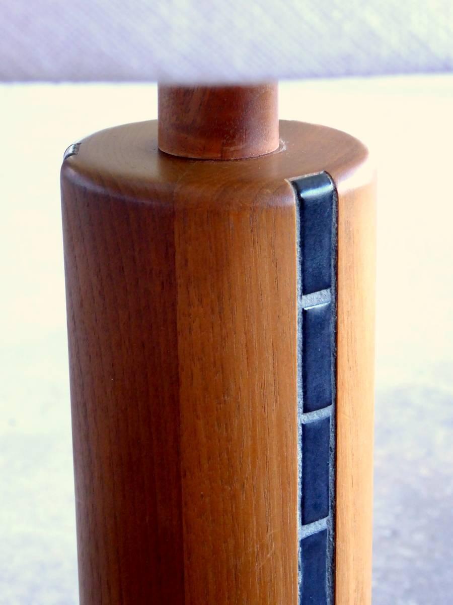 Gordon and Jane Martz's ceramic designs for Marshall Studios are among the most sought-after midcentury pieces. It is not hard to see why. This rarely seen teak table lamp with inset tile is simple but sublime.

A few important notes about all items