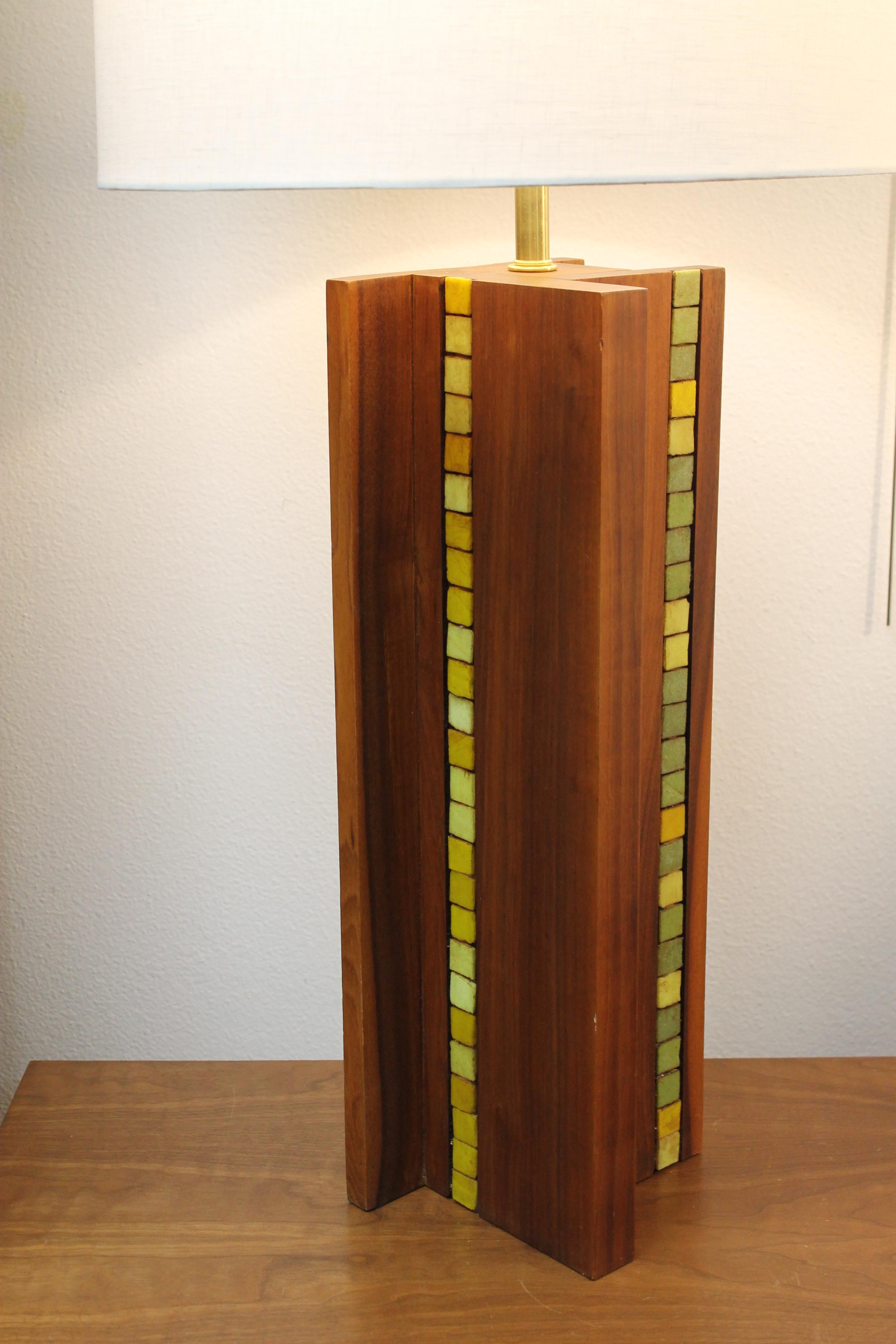 Teak lamp with ceramic tiles in the style of Martz. There are 3 sides which have been tiled.  Lamp is not signed and has been professionally rewired for 3-way light bulbs. Lamp shade is not included. Lamp measures 8.25