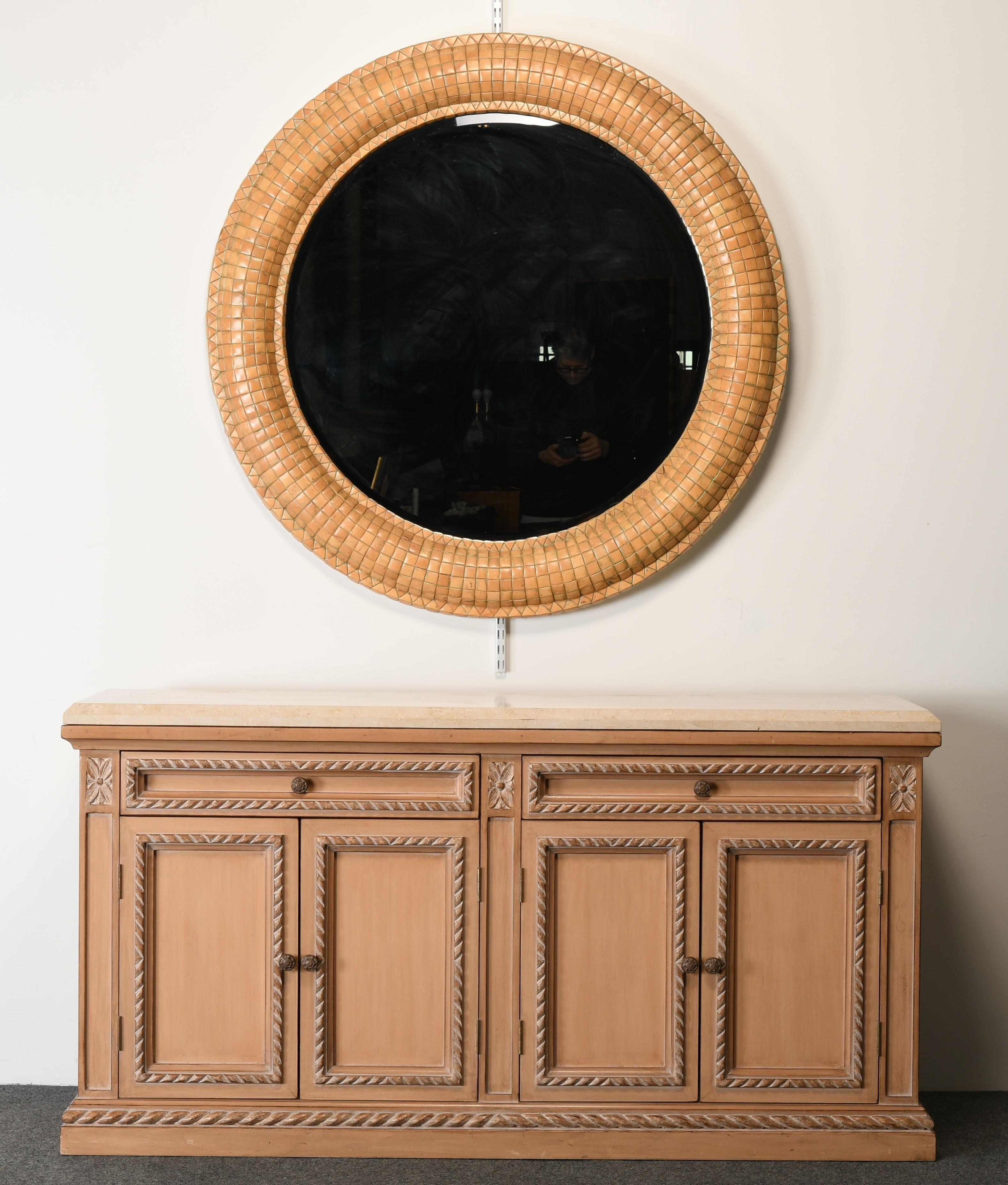 A grand-scale mirror made of tile composite by Kreiss Furniture. This stunning mirror would look great in any contemporary interior. This comes out of a beautifully decorated designer home on the Main Line in Philadelphia. The mirror has beveled