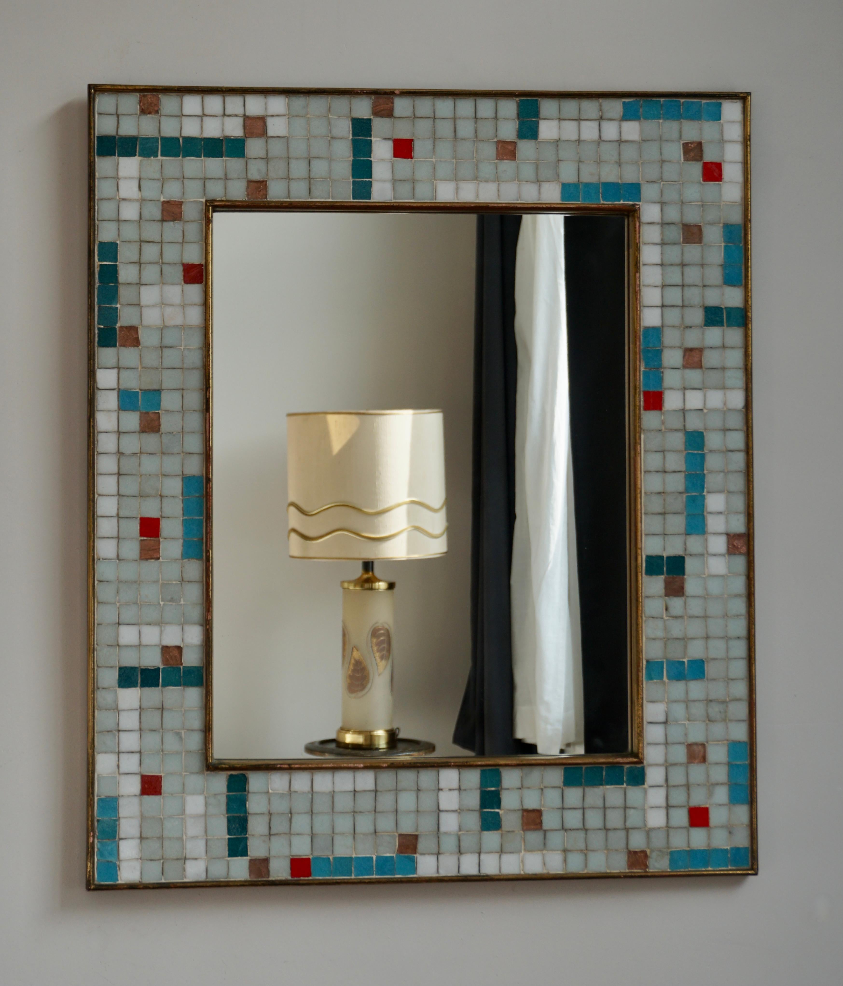 Beautiful Mid-Century Modern mirror with ceramic tile mosaic frame, Italy, 1960s.
 
  