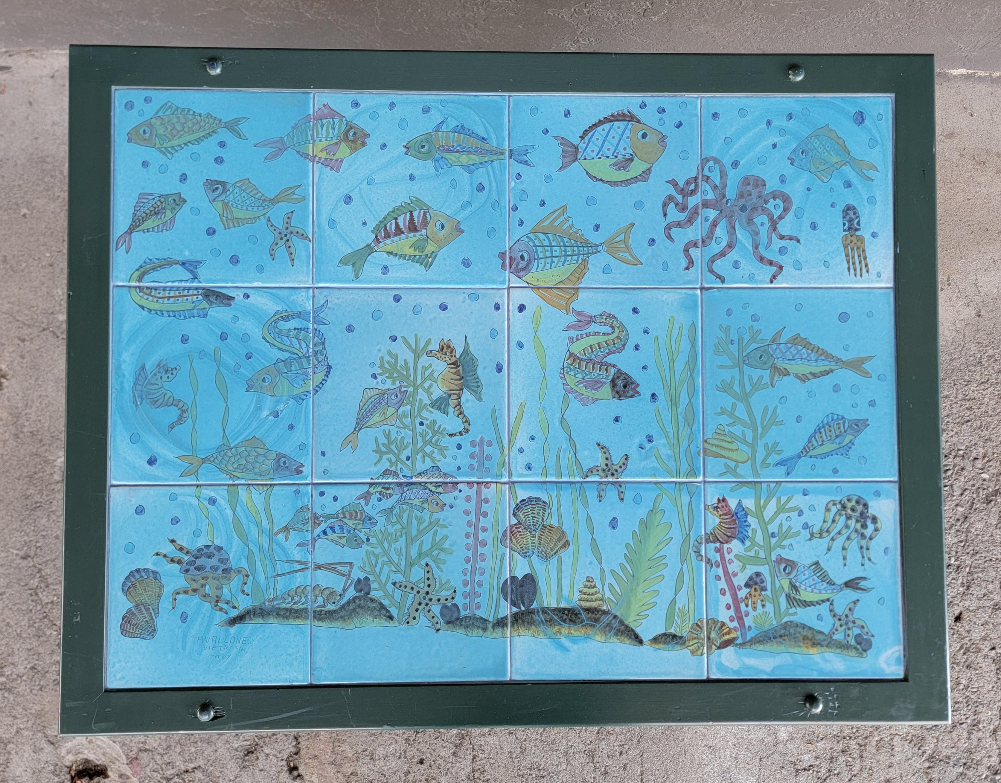 Italian hand painted ceramic tile coffee table. Twelve tiles mounted in painted wood frame with wood backing. Undersea or fish tank motif. Features star fish, octopus, seaweed and more. Signed Vietri 