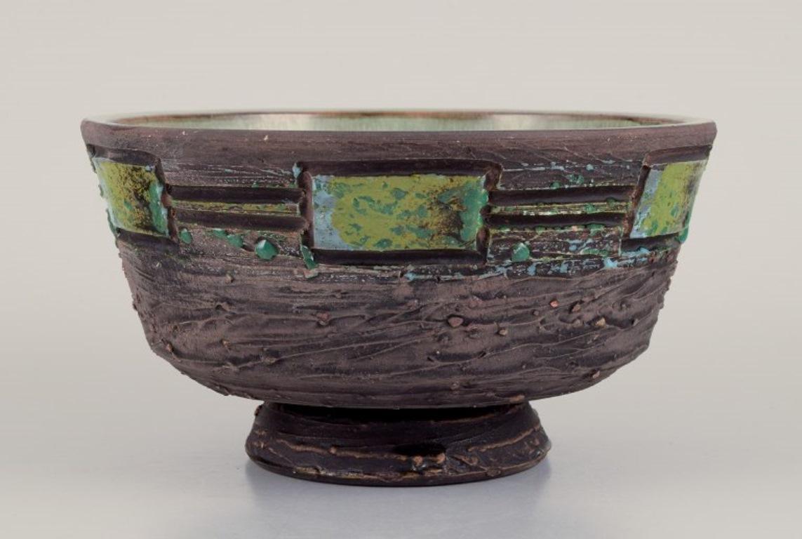Tilgmans Keramik, Sweden. 
Ceramic bowl on a food. Handmade.
Glaze in green tones.
Marked.
Ca. 1970.
Perfect condition.
Dimensions: Diameter 16.5 cm x Height 9.0 cm.