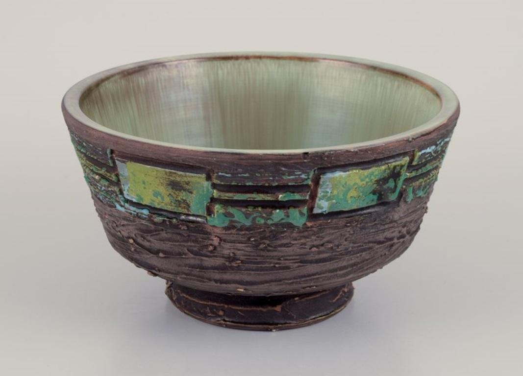 Scandinavian Modern Tilgmans Keramik. Ceramic bowl on a foot. Glaze in green tones. For Sale