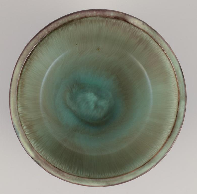 Glazed Tilgmans Keramik. Ceramic bowl on a foot. Glaze in green tones. For Sale
