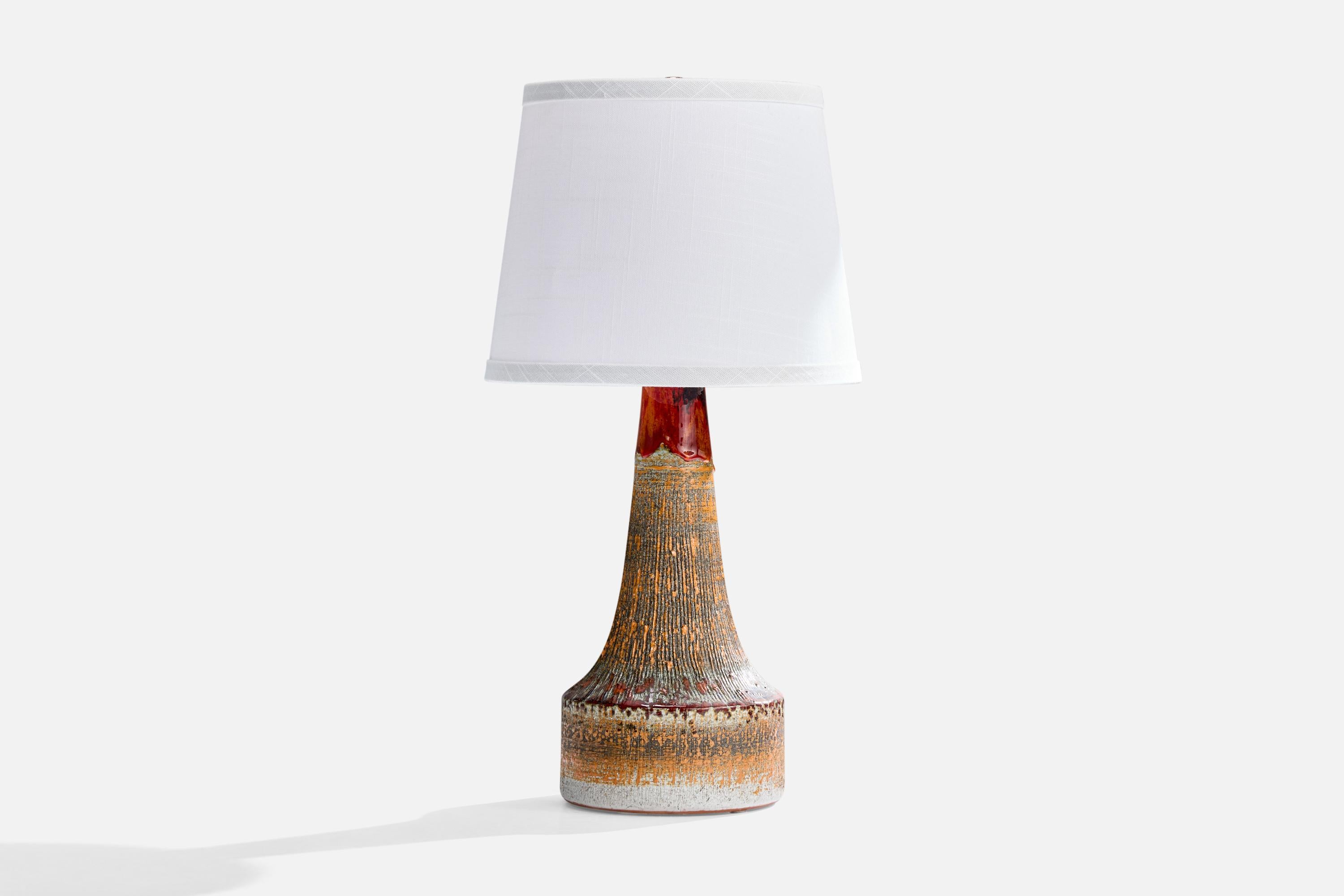 A glazed ceramic table lamp produced by Tilgmans Keramik, Sweden, c. 1960s.

Dimensions of Lamp (inches): 14.5