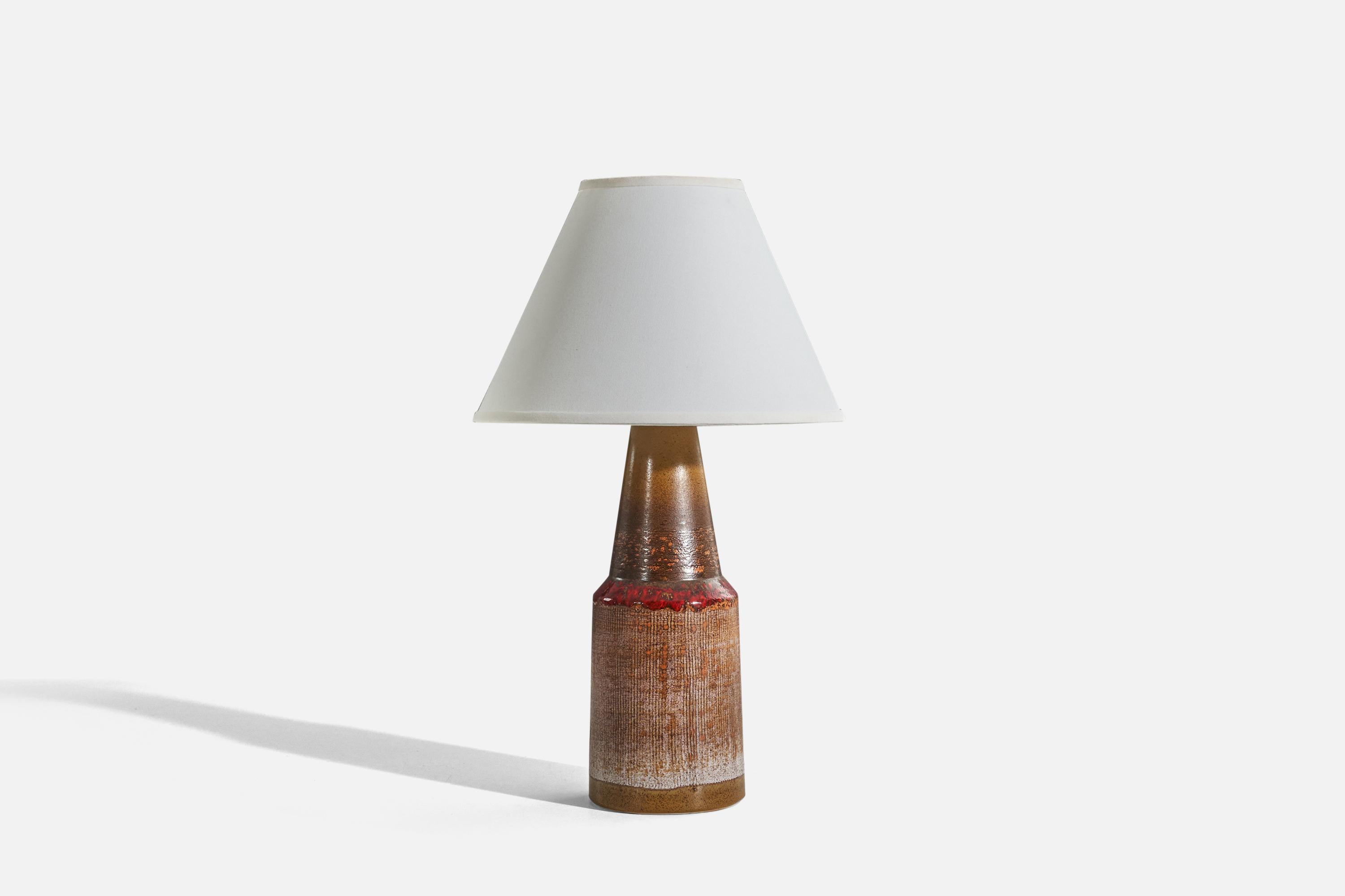 A brown, glazed stoneware table lamp designed and produced by Tilgmans Keramik, Sweden, 1960s. 

Sold without lampshade. 
Dimensions of Lamp (inches) : 16.62 x 5.25 x 5.25 (H x W x D)
Dimensions of Shade (inches) : 5 x 12.25 x 8.75 (T x B x