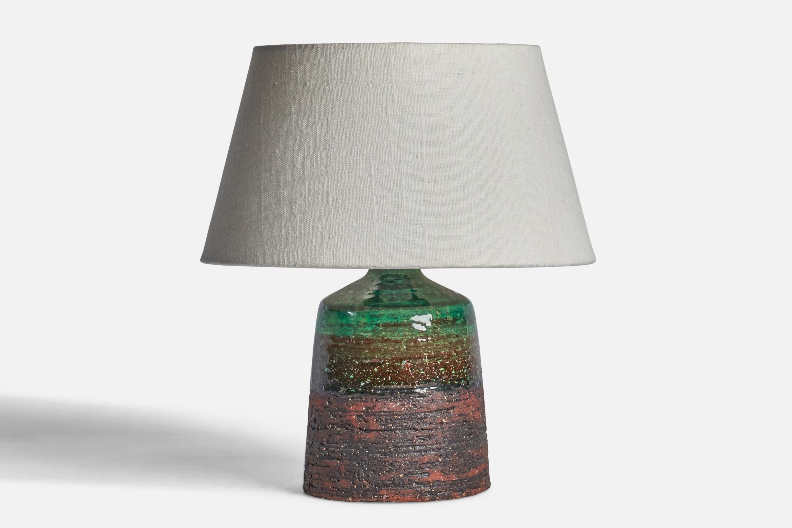 A green and red-glazed stoneware table lamp designed and produced by Tilgmans Keramik, Sweden, 1960s.

Dimensions of Lamp (inches): 9.65” H x 4.80” Diameter
Dimensions of Shade (inches): 7” Top Diameter x 10” Bottom Diameter x 5.5” H 
Dimensions of