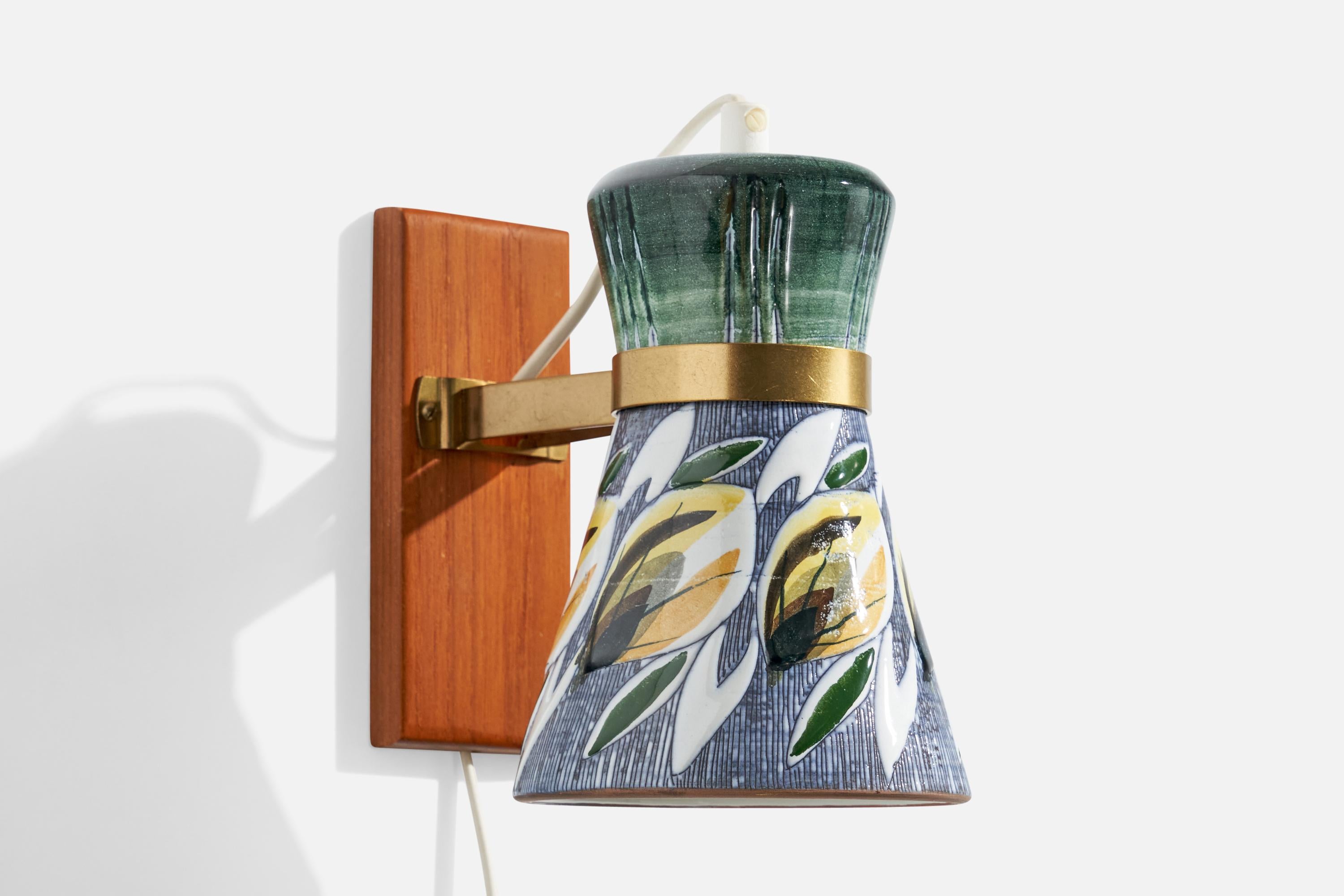 A teak, brass and hand-painted ceramic wall light produced by Tilgmans, Sweden, c. 1950s.

Overall Dimensions (inches):  6.5” H x  4.75” W x  7“ D

Back Plate Dimensions (Inches):  6” H x 2.5” W x .5” D

Bulb Specifications: E-26

Number of Sockets