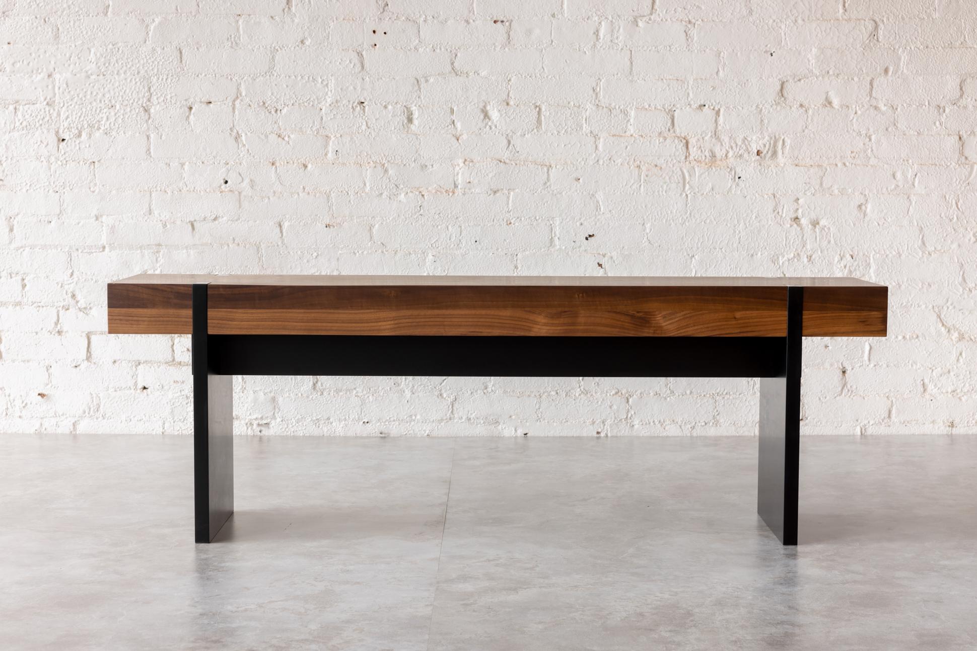 The dramatic Tillikum Black by Autonomous Furniture features our Black Walnut solid wood top set on striking matte black frame and legs. The minimalist design by Kirk Van Ludwig combines these elements to create a modern handcrafted bench. A welcome