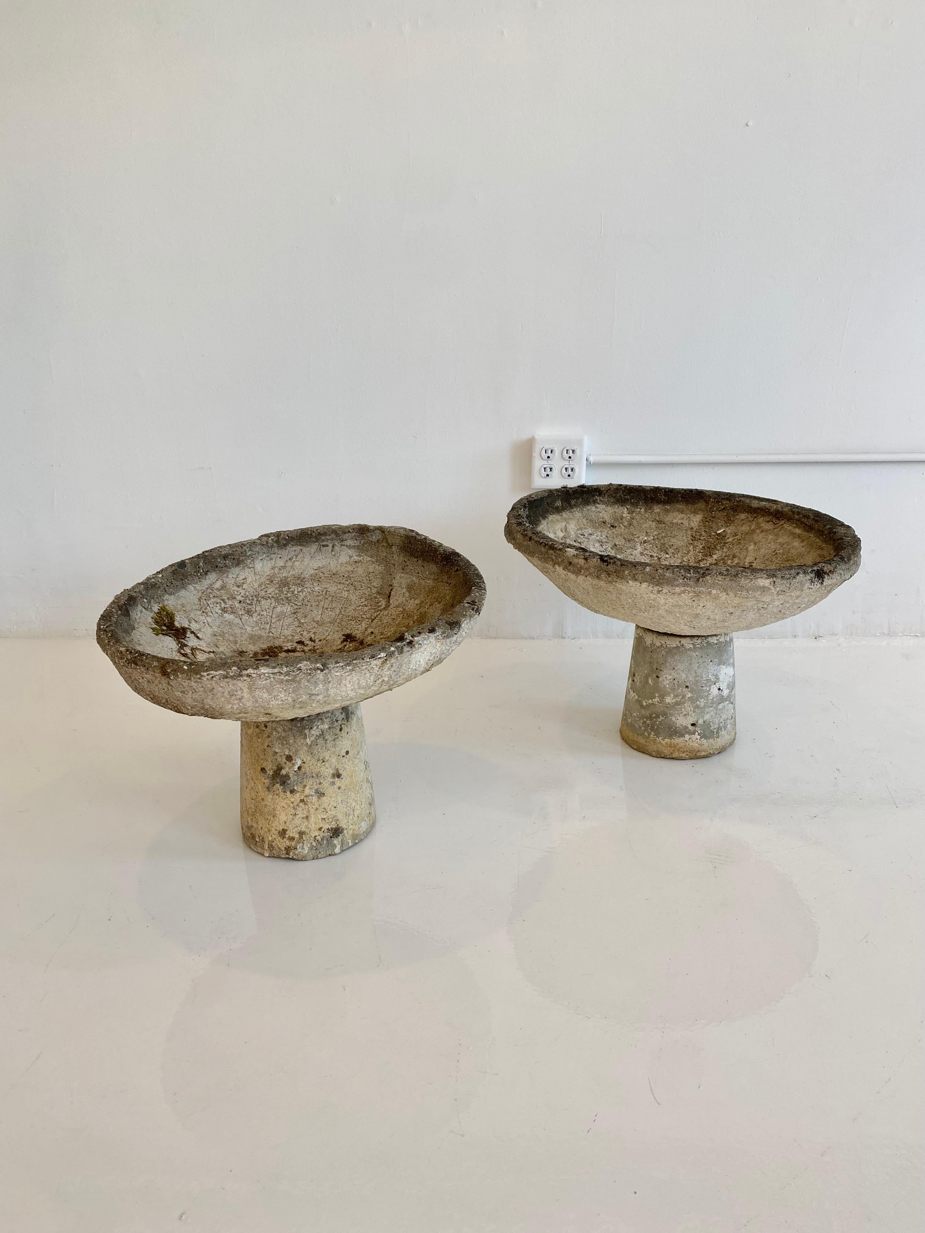 French concrete tilted bowl planters with base. Bowl is removable and sits on top of the cylindrical base. All slightly varying patinas. Very sturdy. Look great grouped together as a set. 7 available. Priced individually.