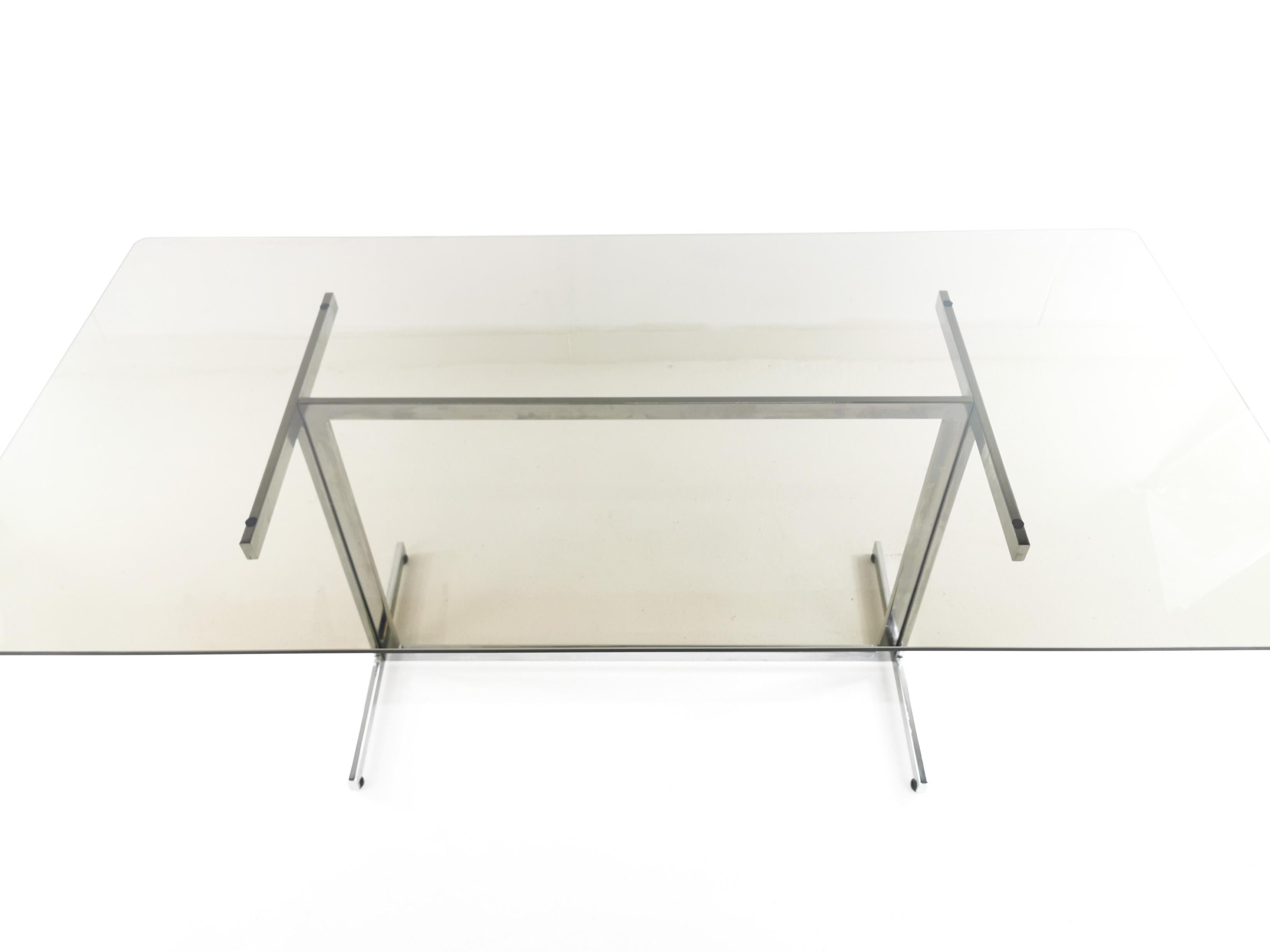 Pieff dining table

A 1970s Tim Bates for Pieff smoked glass and chrome dining table and or desk. A typical 1970s sleek design from the midcentury was considered a luxury furniture item and offered in excellent condition with light usage