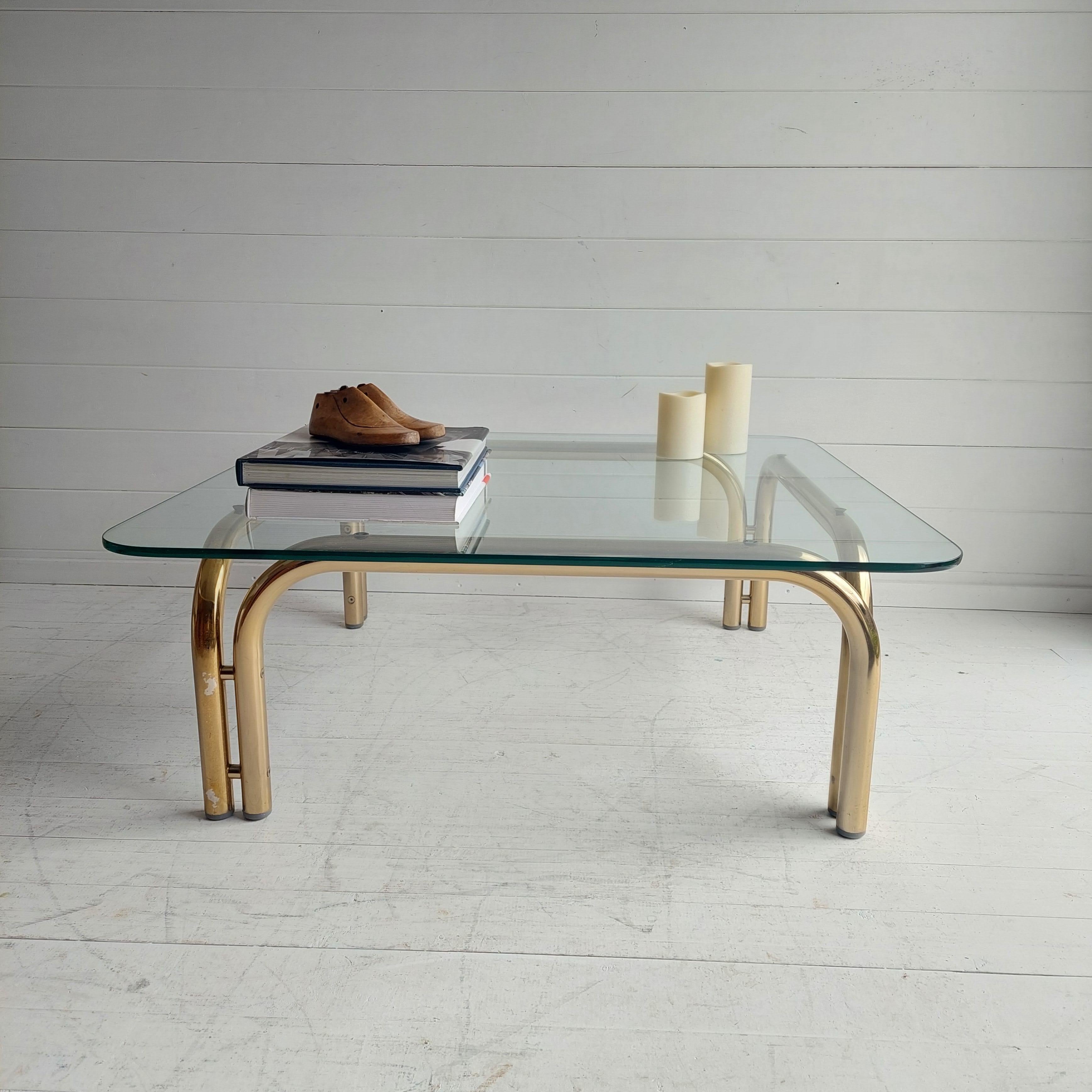 A rare example fron Tim Bates for Pieff Mid-Century Modern Gilded chrome & clear glass coffee table.
A remarkable large square coffee table, designed by Tim Bates for English manufacturer Pieff.

Having a thick toughened smoked glass top (0.8cm)