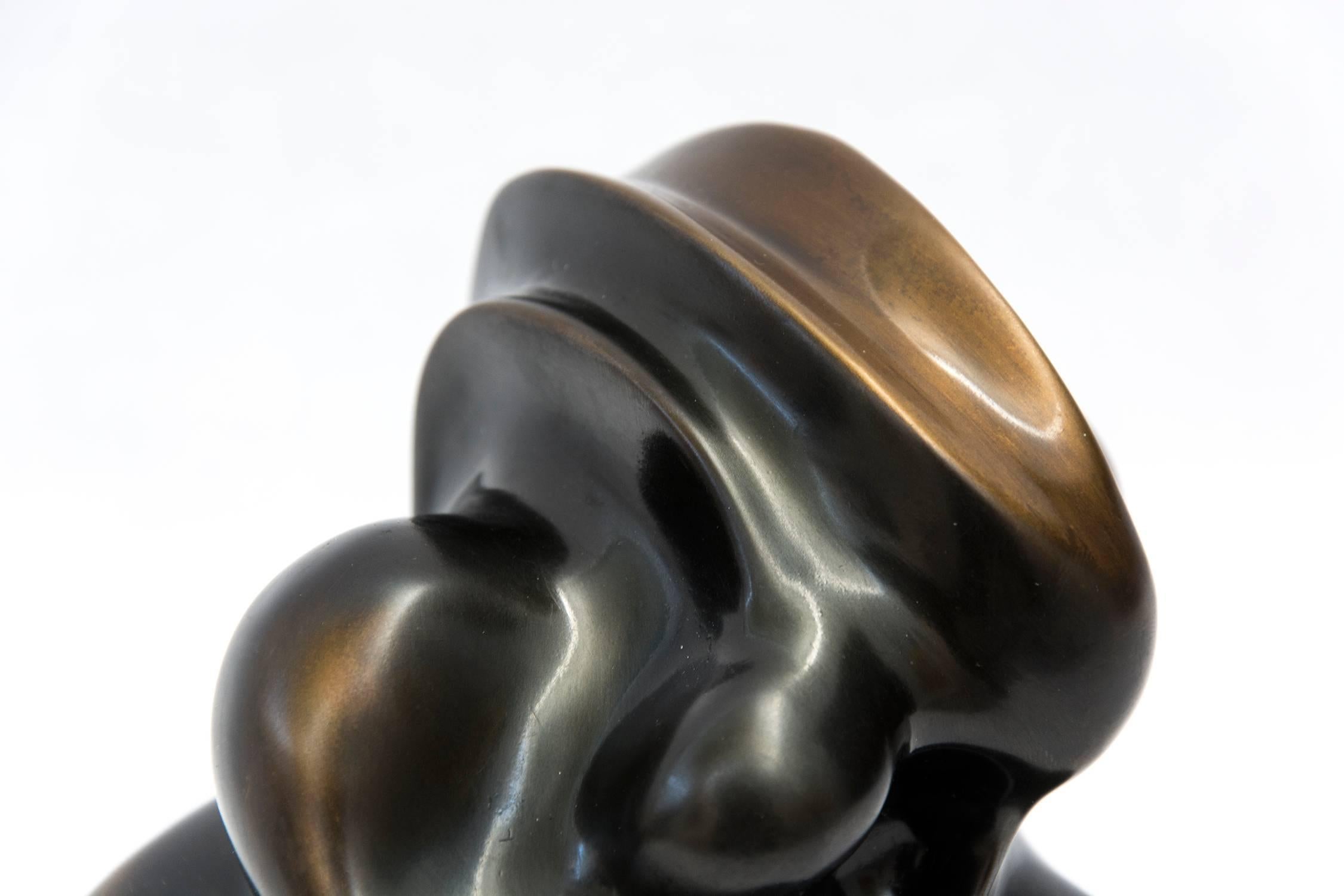 Patinated cast bronze takes an organic form that twists and breathes as it emerges from its base. The dynamic movement of this intimately sized sculpture is informed by Tim Forbes' training in graphic and interior design. 

After completing studies