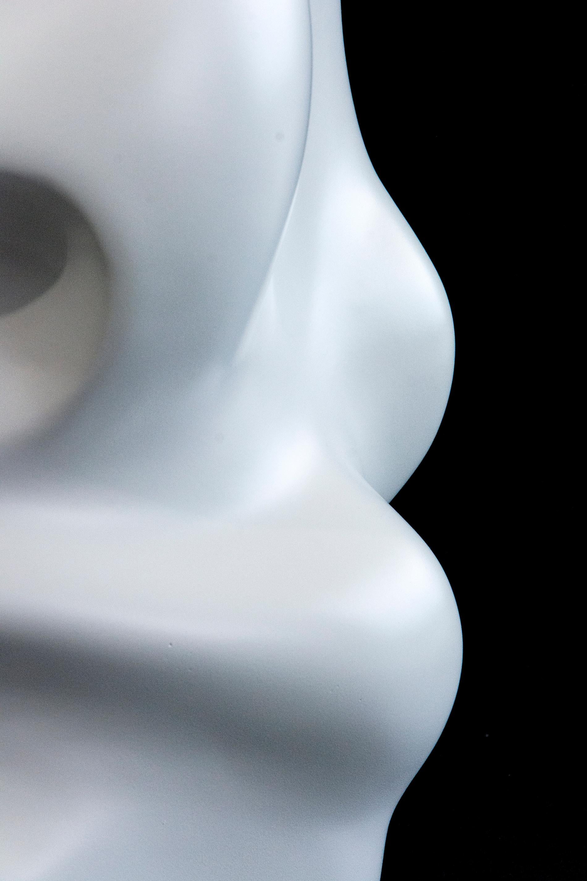 Cast in resin and coated in a satin white, this abstract sculpture by Tim Forbes twists and breathes as it rises. The dynamic movement of this work is informed by Forbes' training in graphic and interior design.

After completing studies at the Nova