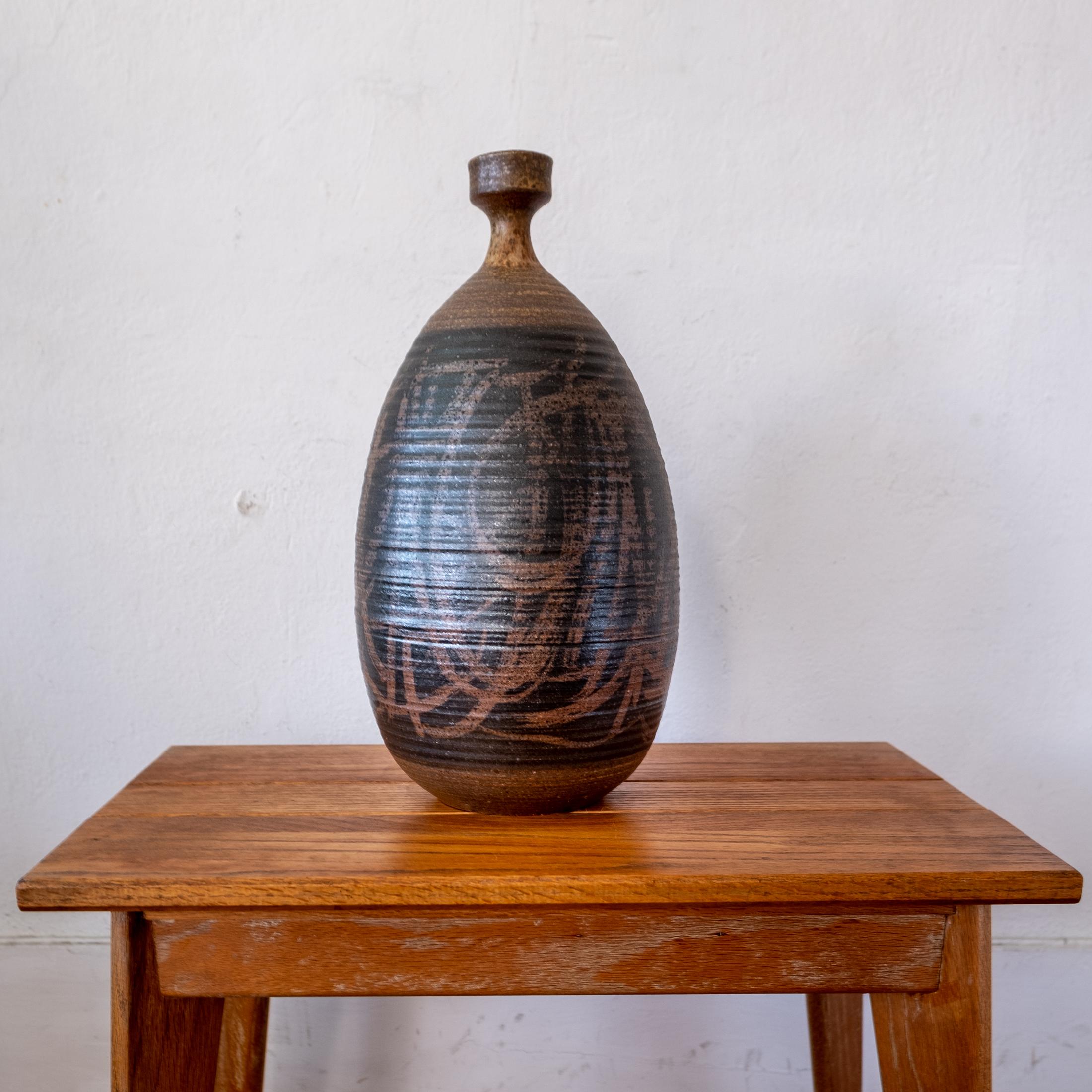 Large stoneware vessel by contemporary California ceramic artist, Tim Keenan. As evident with the abstract expressionist wax resist design, Keenan is a highly skilled potter and artist.