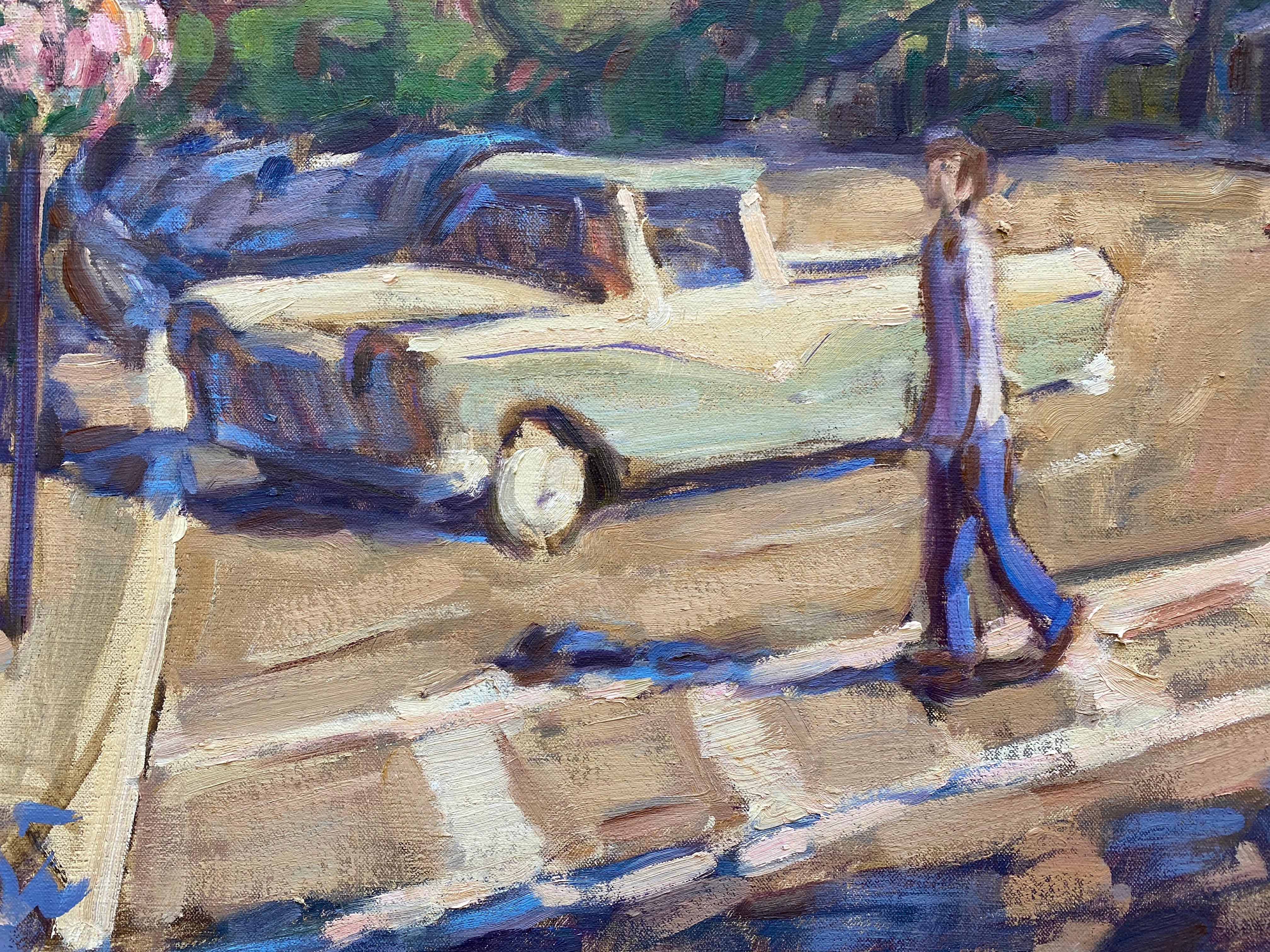 Painted from life in the Village of Sag Harbor, McGuire captures a lively scene. Two figures cross the street, using the crosswalk, one man in jeans and a tee-shirt, and one woman in a red dress. A vintage truck starts a line of parked cars along.