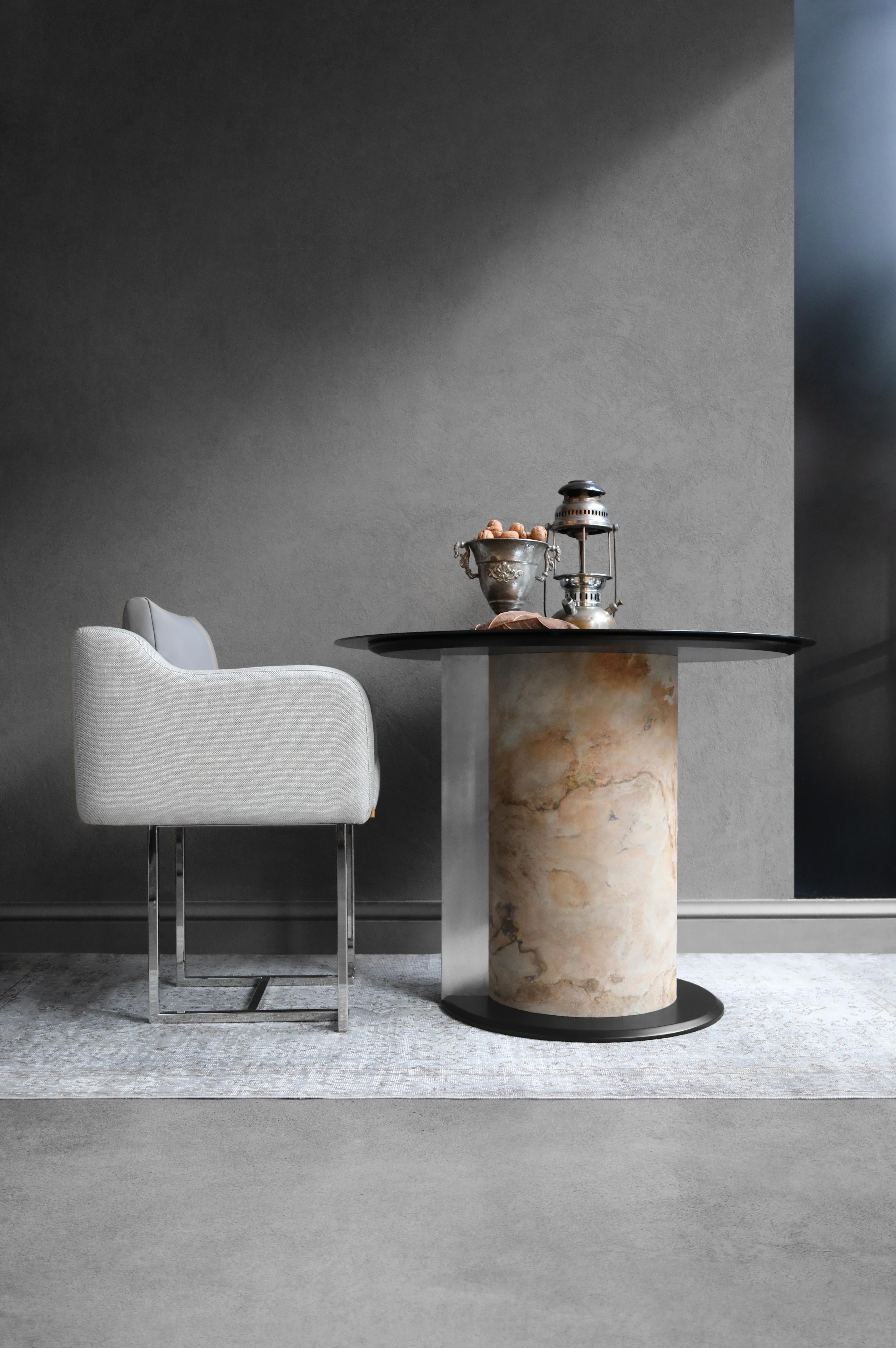 Get harmony in your home with TIM TABLE, which combines cirucular body, glass top, wood and metal details with different materials... 

Combining lagu's signature materials, brass and black glass, TIM TABLE creates an impact much larger than its