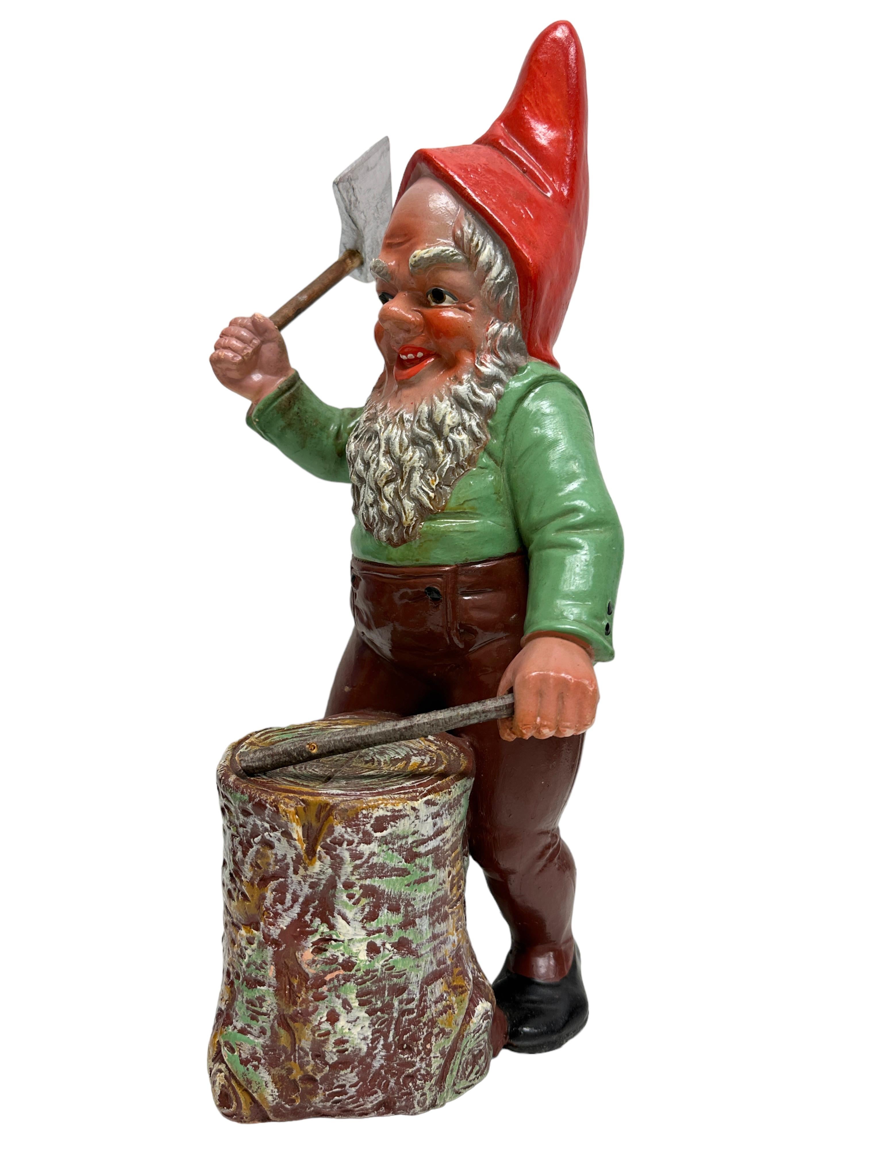 A gorgeous character ceramic figural gnome statue. This character statue has been made in Germany, in the 1910s or older. Absolutely gorgeous item with lots of character and still in good, used condition, without damage. Some paint lost, but this is