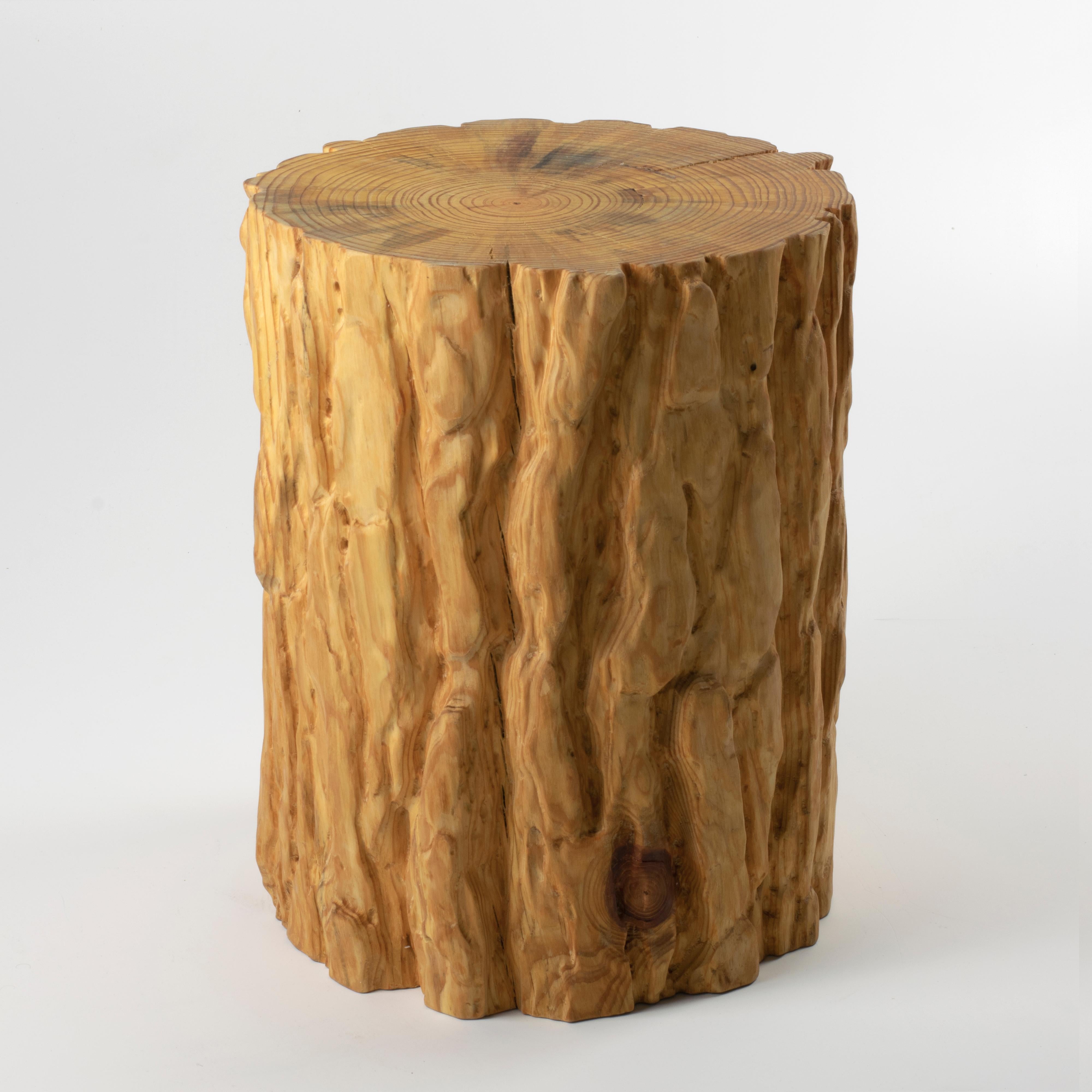 These wooden stools are digitally fabricated by artist Ezra Ardolino at Timbur LLC. 

The process consists of pine bark displacement data mapped to a cylindrical form; zero, forty-five and ninety degree rotations. Robotically machined in kiln dried