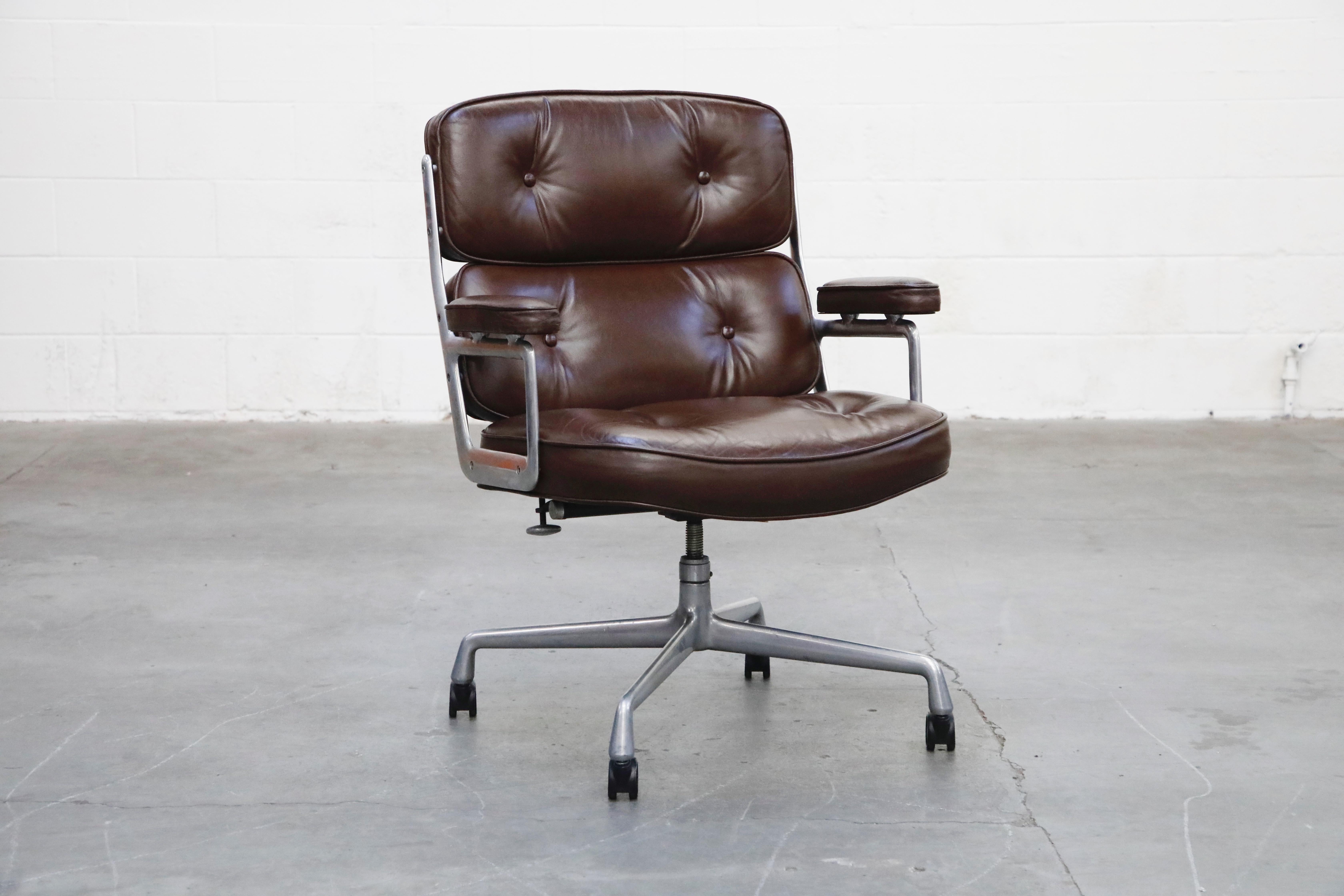 These incredible deep brown leather 'Time Life' executive swivel desk chairs were designed by Charles and Ray Eames in 1959 and manufactured by Herman Miller. Known to be the most comfortable and ergonomic executive chair, these Time Life Executive
