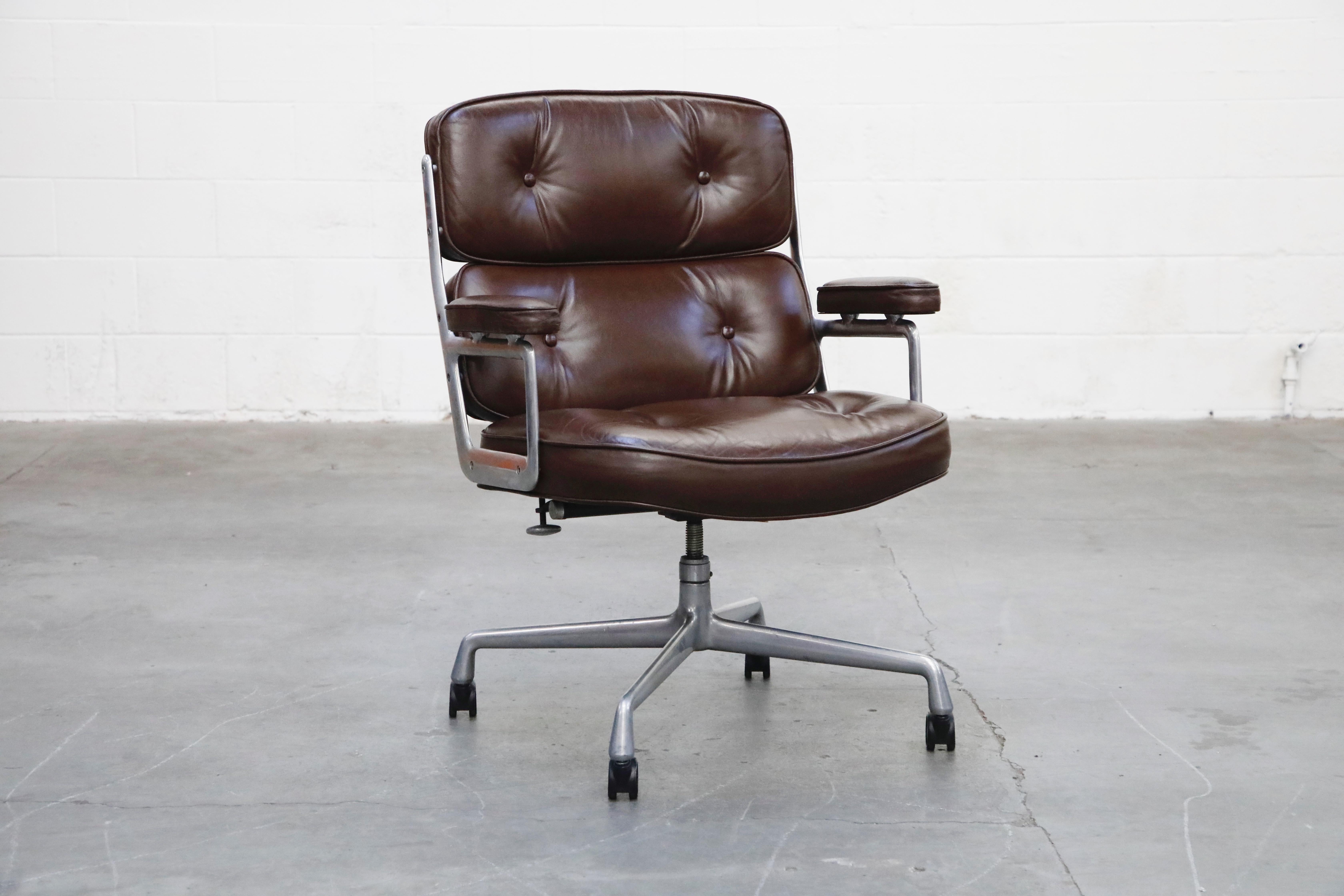 These incredible deep brown leather 'Time Life' executive swivel desk chairs were designed by Charles and Ray Eames in 1959 and manufactured by Herman Miller. Known to be the most comfortable and ergonomic executive chair, these Time Life Executive
