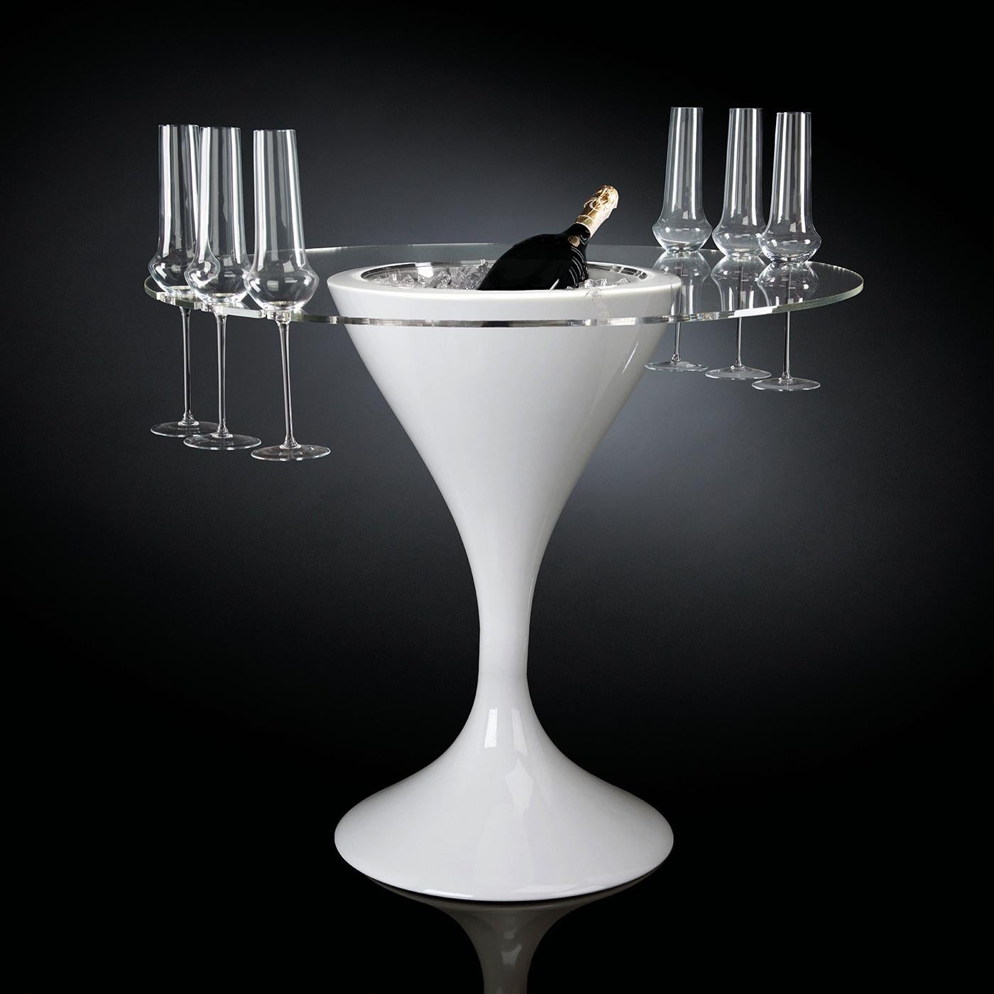 A singular sculptural piece of functional decor, this cocktail table will make a refined statement in a modern living room. Fashioned of polished white-lacquered resin, the structure features a round central cavity that functions as a champagne