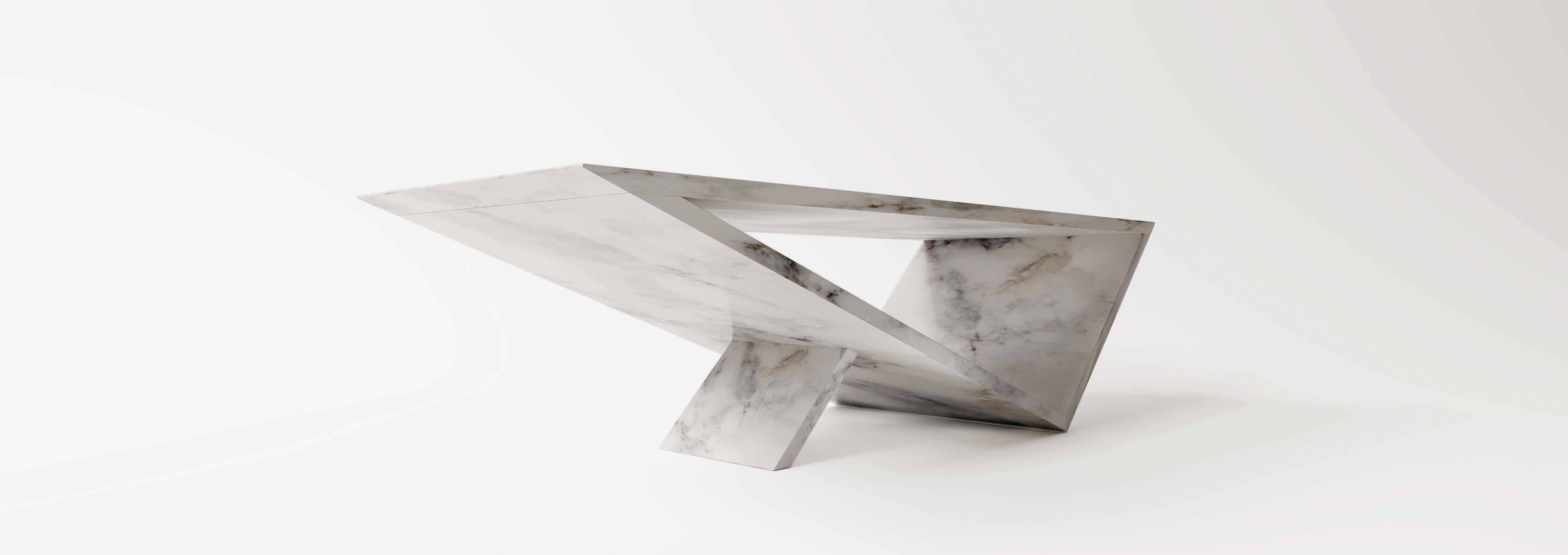 Time/space Portal Coffee Table in Carrara marble.

The inspiration for the Time/Space Portal Table collection comes from the power, simplicity, and elegance of the triangle.
This is an ongoing series exploring the dynamics of balance, weight,