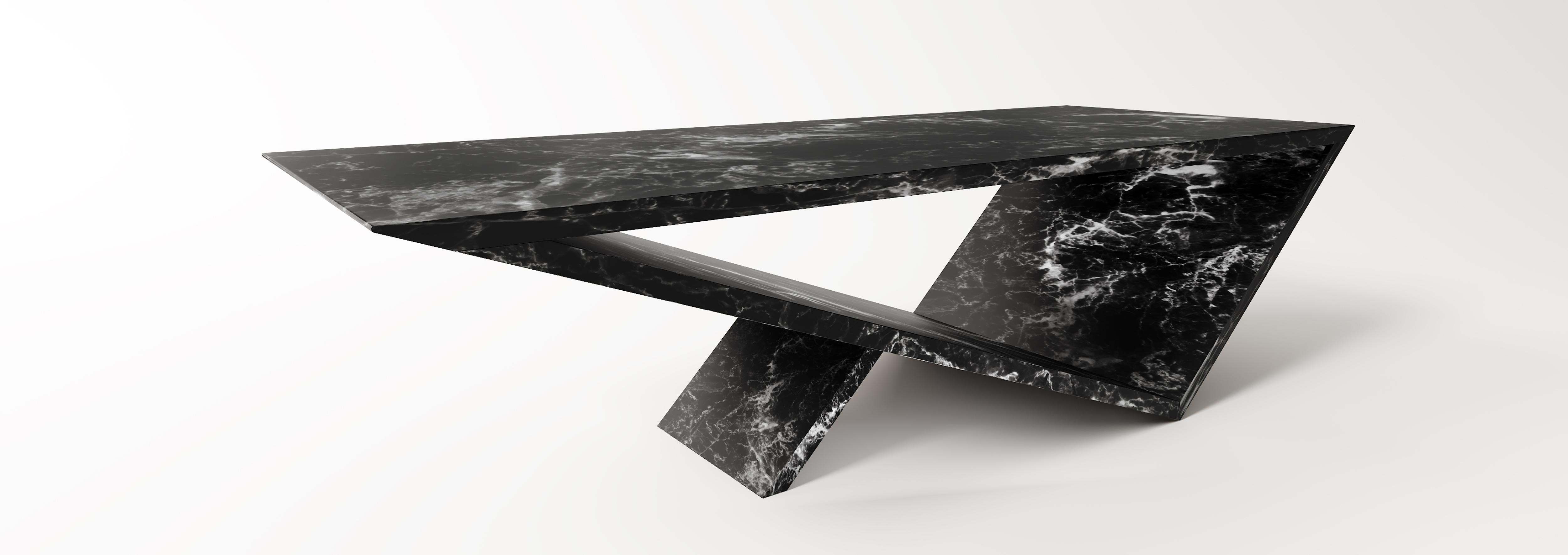 Time/space Portal Coffee Table in Black Marble.

The inspiration for the time/space portal table collection comes from the power, simplicity, and elegance of the triangle.
This is an ongoing series exploring the dynamics of balance, weight, gravity,