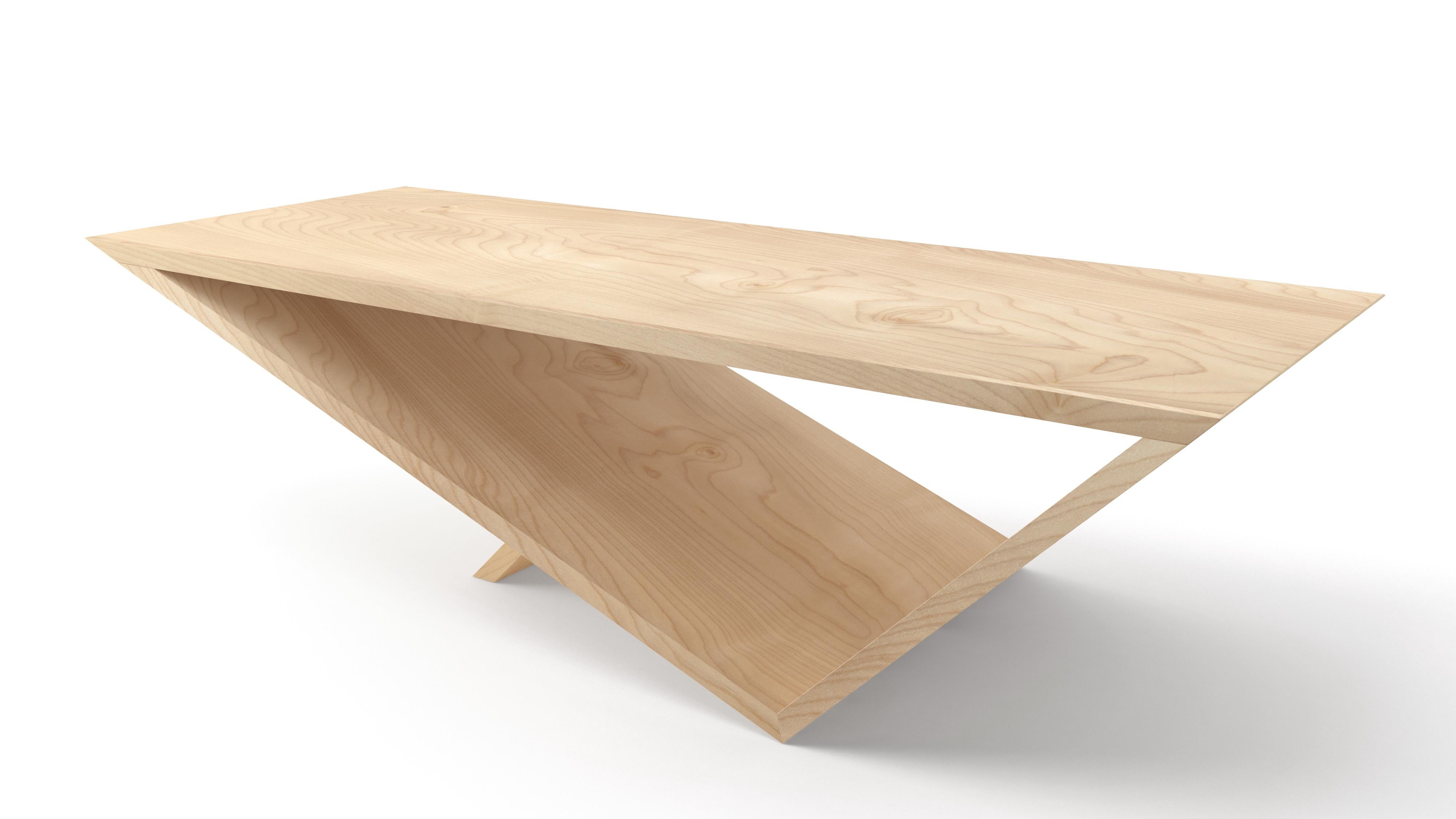 Time/Space Portal Table in solid maple hardwood.

The inspiration for the Time/Space Portal Table collection comes from the power, simplicity, and elegance of the triangle.
This is an ongoing series exploring the dynamics of balance, weight,