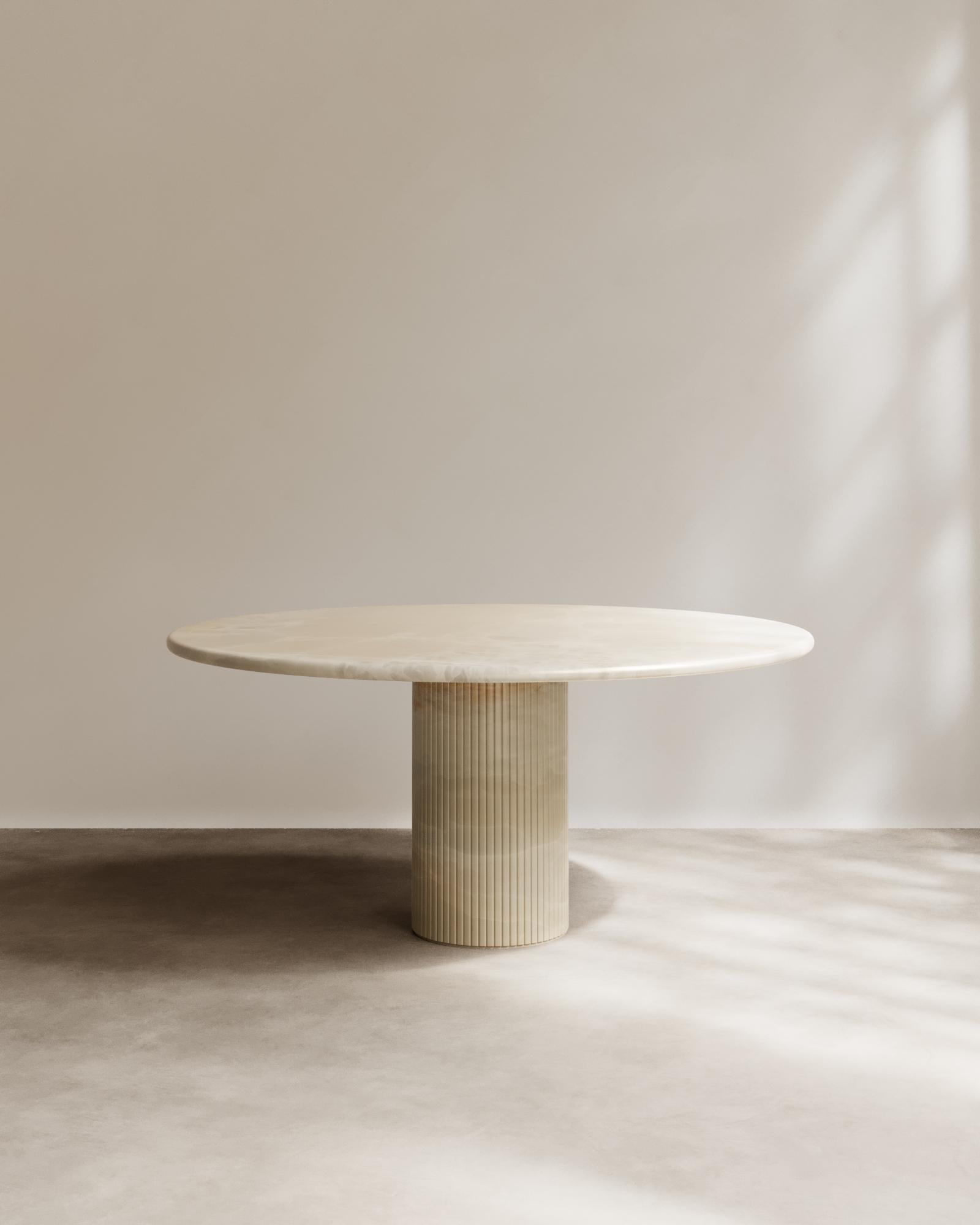 Time Table II Round Dining Table in Bianco Onyx by Paloma Editions
Dimensions: D 130 x W 130 x H 75 cm.
Materials: Bianco onyx.

Edges are hand-finished with a 2mm chamfer to articulate the transition between planes. The onyx surfaces are polished