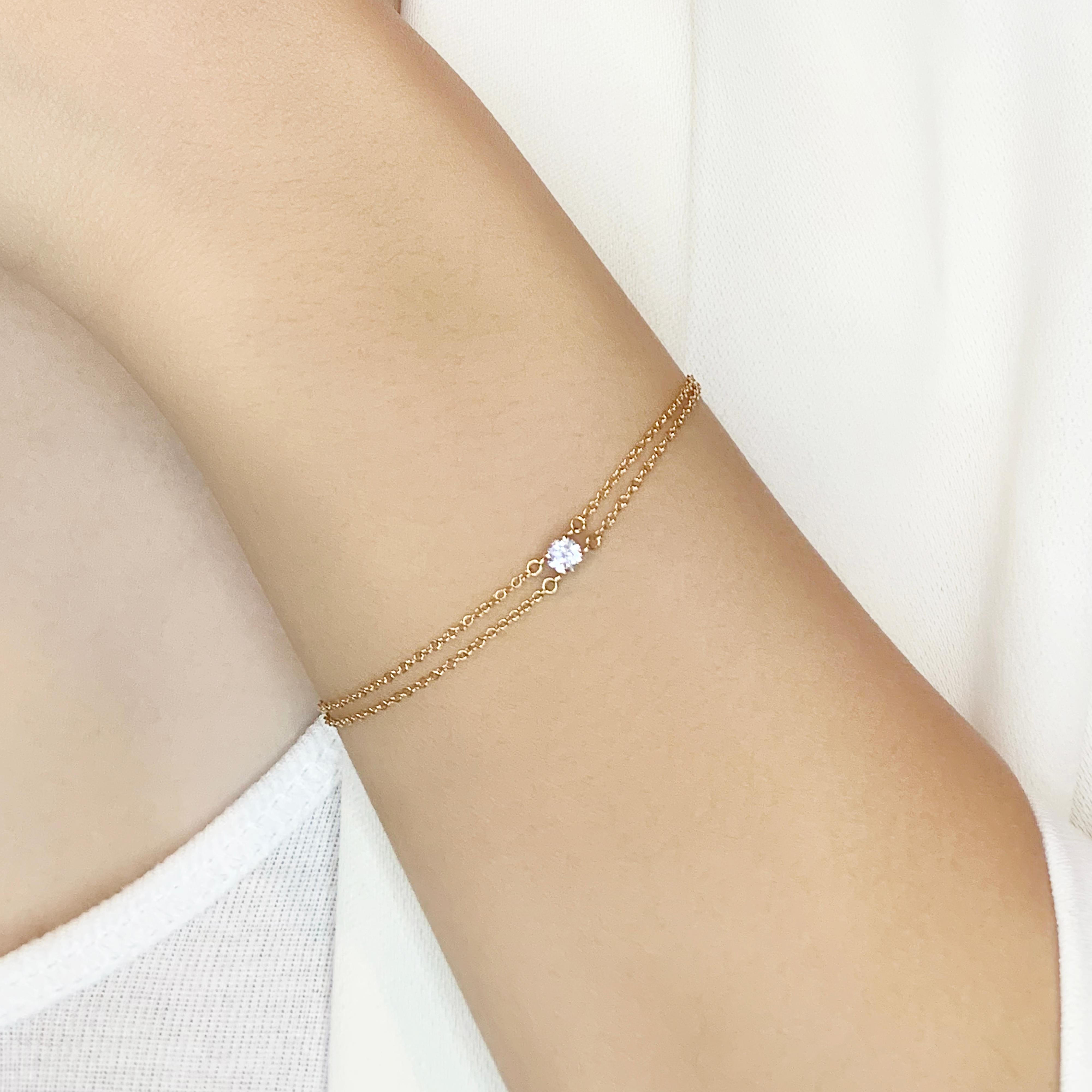 Enhance your jewelry collection with this beautiful bracelet from Tiffany & Co., crafted from 18K rose gold. This piece features a single natural diamond with a carat weight of 0.18ct. The round brilliant diamond has a color grade of G and a clarity