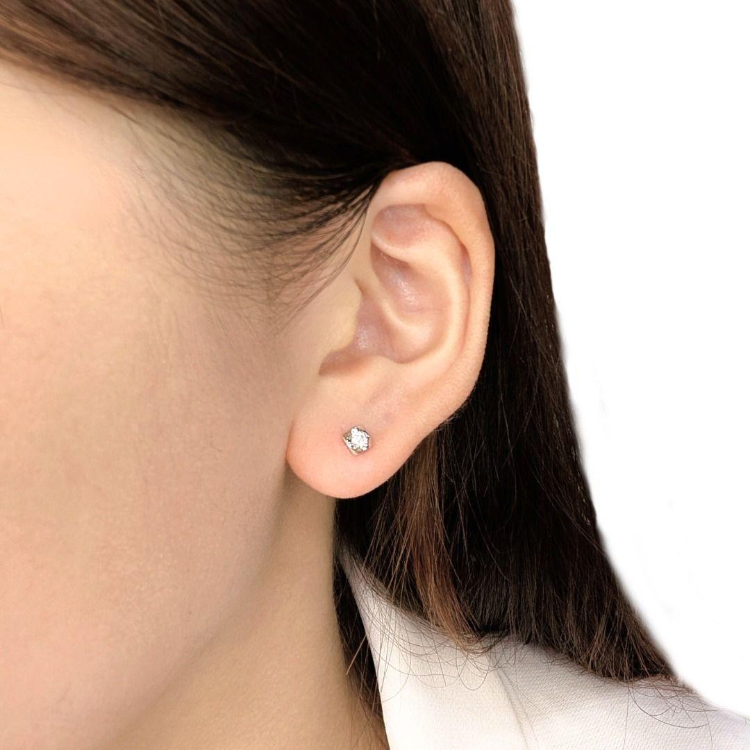 Discover the perfect touch of everyday sparkle with these dainty diamond stud earrings, beautifully set in lustrous 18K white gold. Each earring features a bright, natural round brilliant diamond, perfectly proportioned for a look of understated