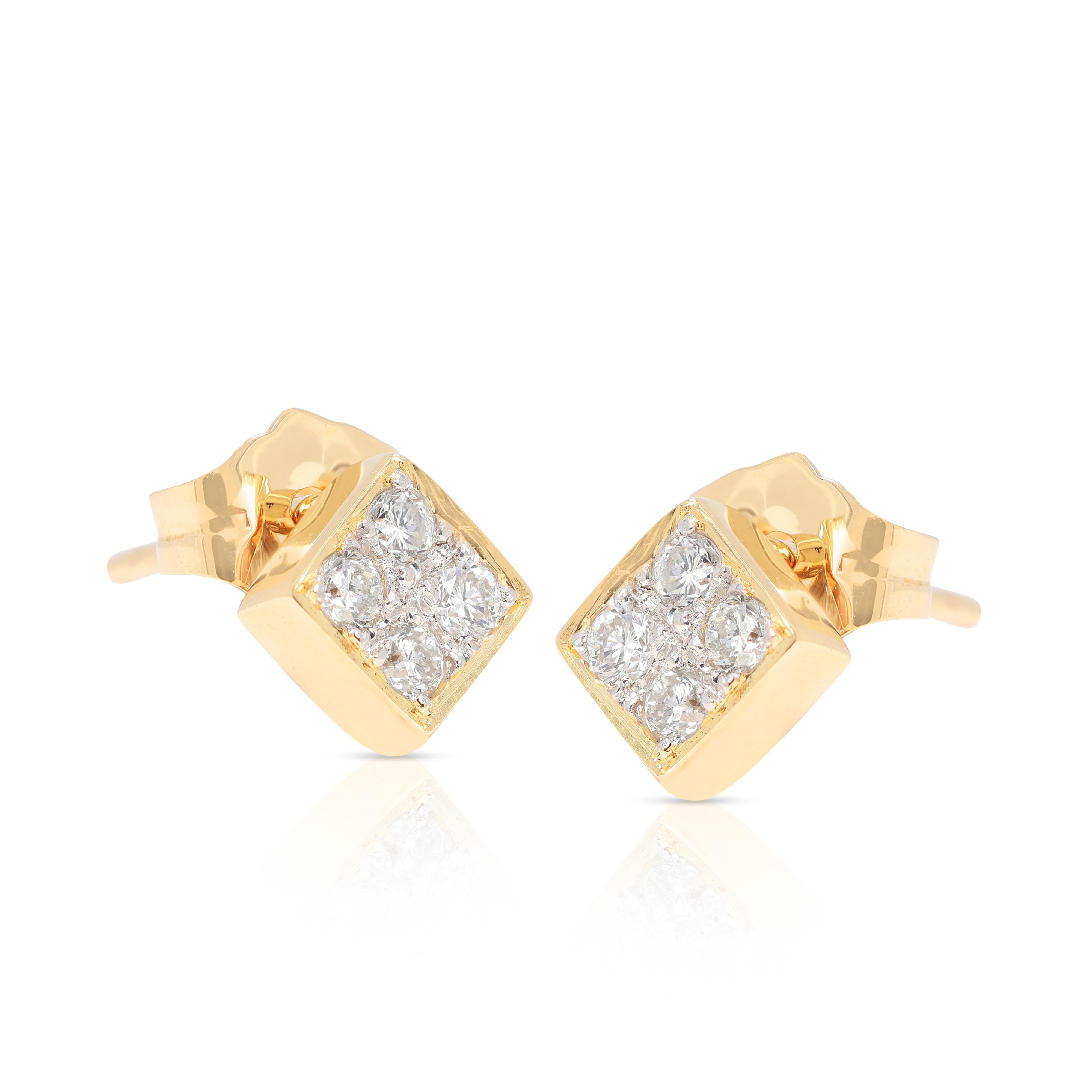 Elevate your elegance with these stunning earrings, crafted from luxurious 18K yellow gold. Each earring features four brilliant round diamonds, totaling 0.24 carats, with a superb F color grade and VS clarity. These diamonds shimmer with