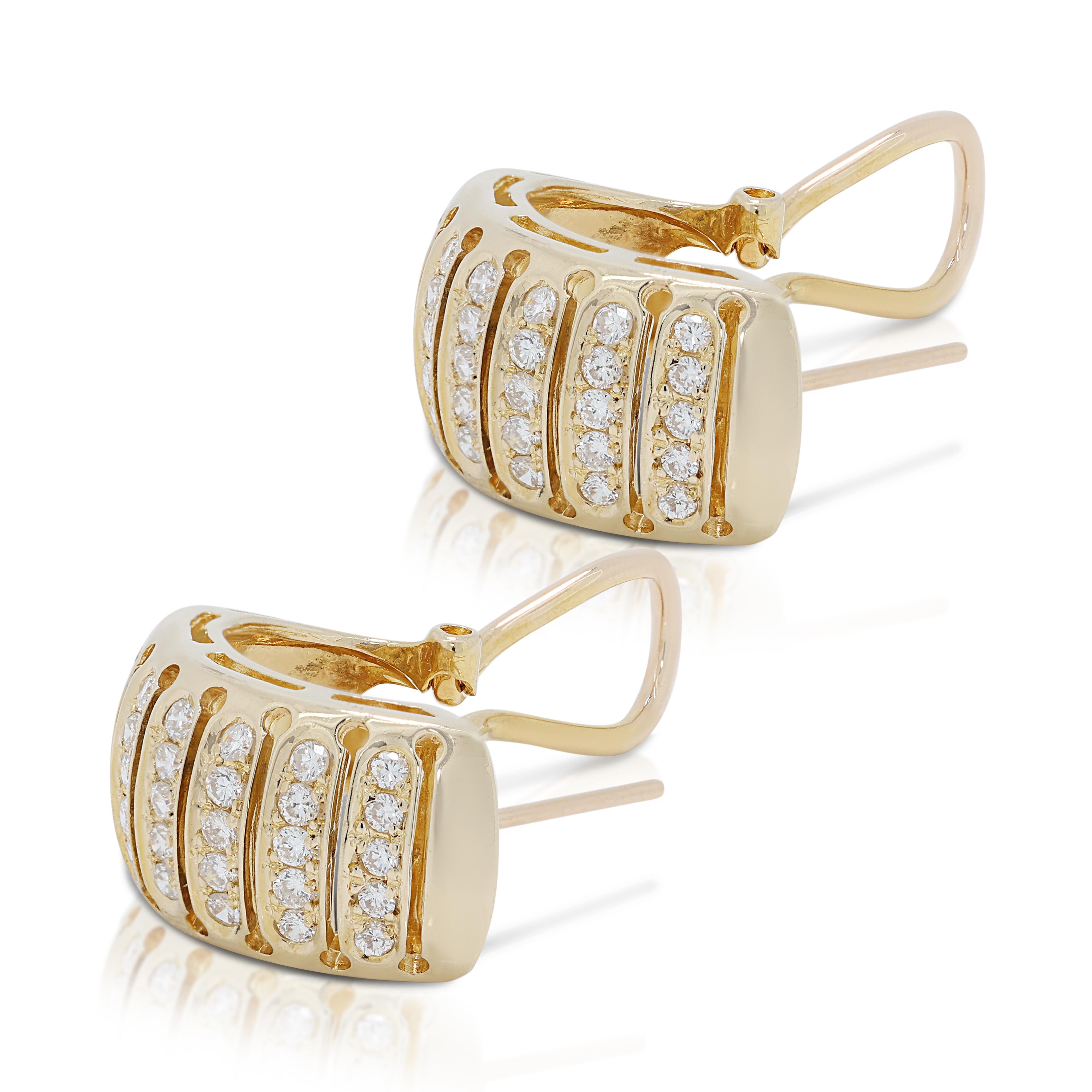 Indulge in timeless elegance with these stunning diamond earrings, crafted in gleaming 18k yellow gold. Each meticulously cut diamond boasts a captivating 0.42 carat round brilliant shape, showcasing a near-colorless grade reflecting exceptional