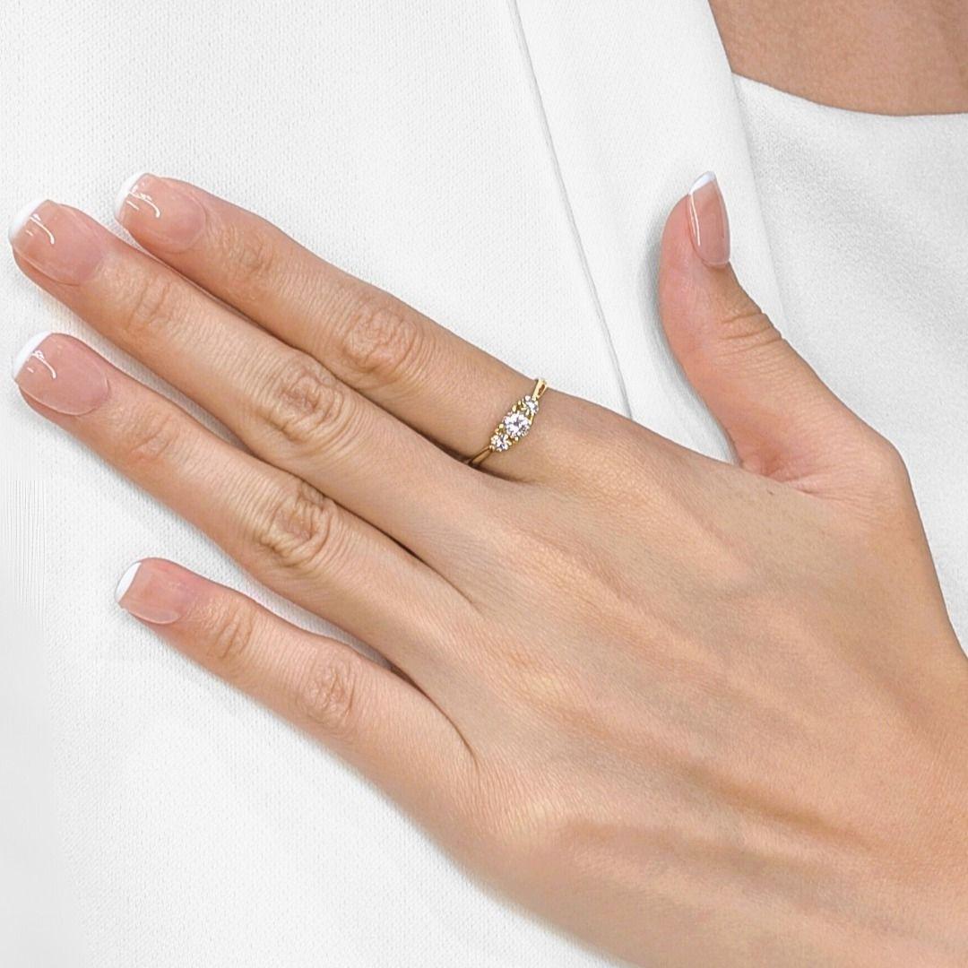 Celebrate your past, present, and future with this classic 3-stone ring, meticulously crafted in radiant 18K yellow gold. Three dazzling natural round brilliant diamonds, totaling a brilliant 0.54ct, are elegantly set to symbolize enduring love and