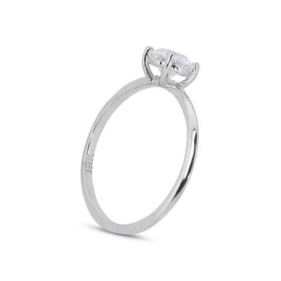Embrace timeless brilliance with this exquisite 0.70 carat Round Brilliant Diamond Ring crafted in gleaming 18K White Gold (IGI certified, report number 617481083 verifiable online).

A diamond with a color grade of D is exceptionally rare,