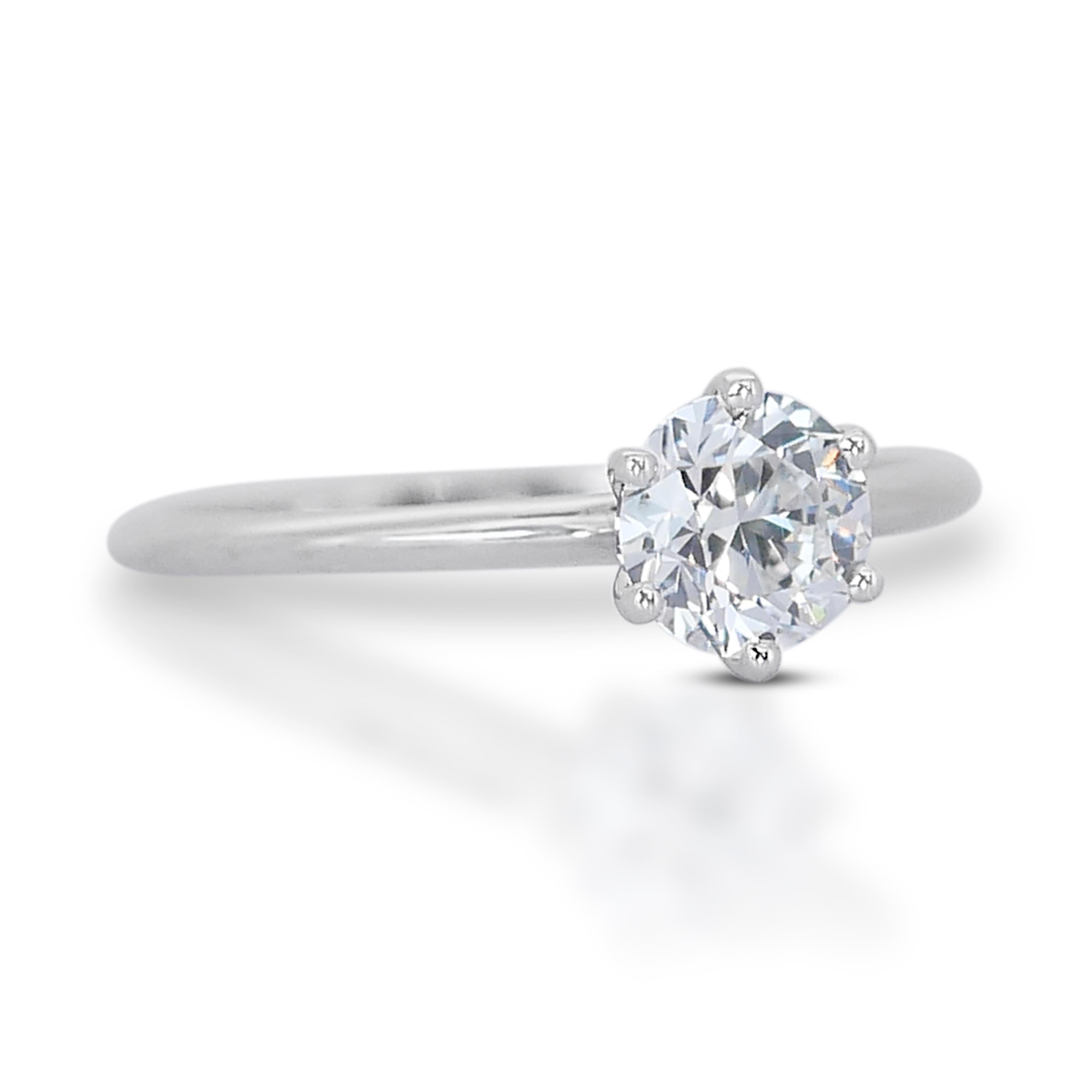 Timeless 0.70ct Diamond Solitaire Ring in 18k White Gold - GIA Certified

This luxurious 18k white gold diamond solitaire ring features a stunning 0.70-carat round diamond, expertly cut to triple excellent standards for maximum brilliance. The