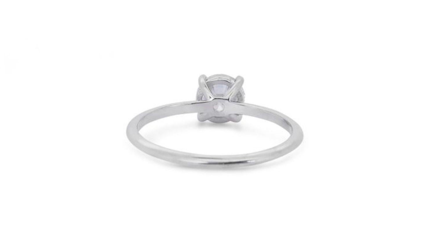 Timeless 0.71 carat Round Brilliant Diamond Ring in 18K White Gold For Sale 1
