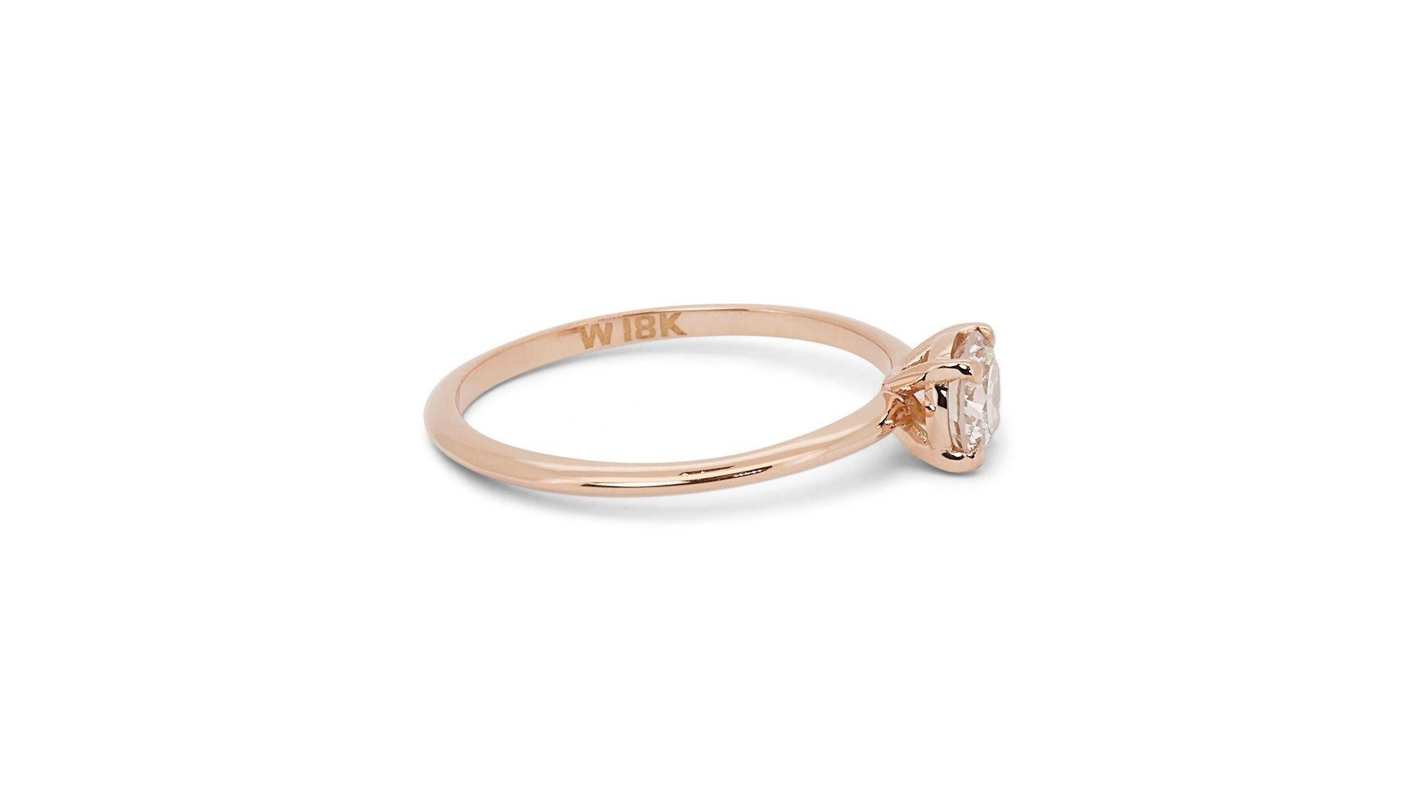 Timeless 0.80ct Diamond Solitaire Ring in 18k Rose Gold - GIA Certified

Embrace the allure of this exquisite 18k rose gold solitaire ring, highlighted by a captivating 0.80-carat round diamond. Certified by GIA, it reflects a commitment to quality