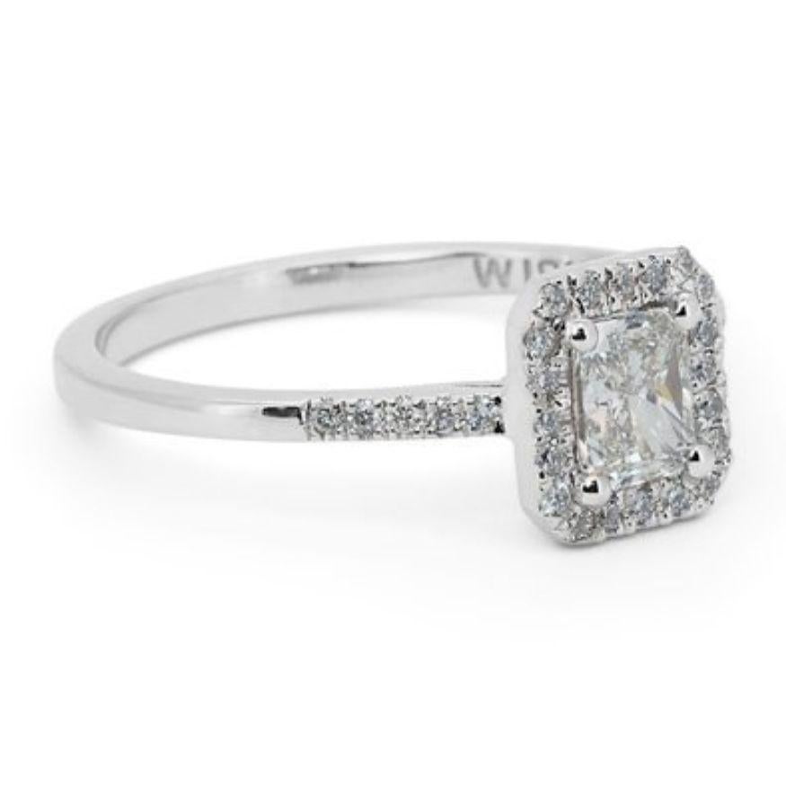 Embrace captivating fire and timeless elegance with this breathtaking radiant diamond ring, showcasing a dazzling 0.9 carat center stone that radiates brilliance and modern sophistication. Crafted in gleaming 18K white gold, this exquisite piece is