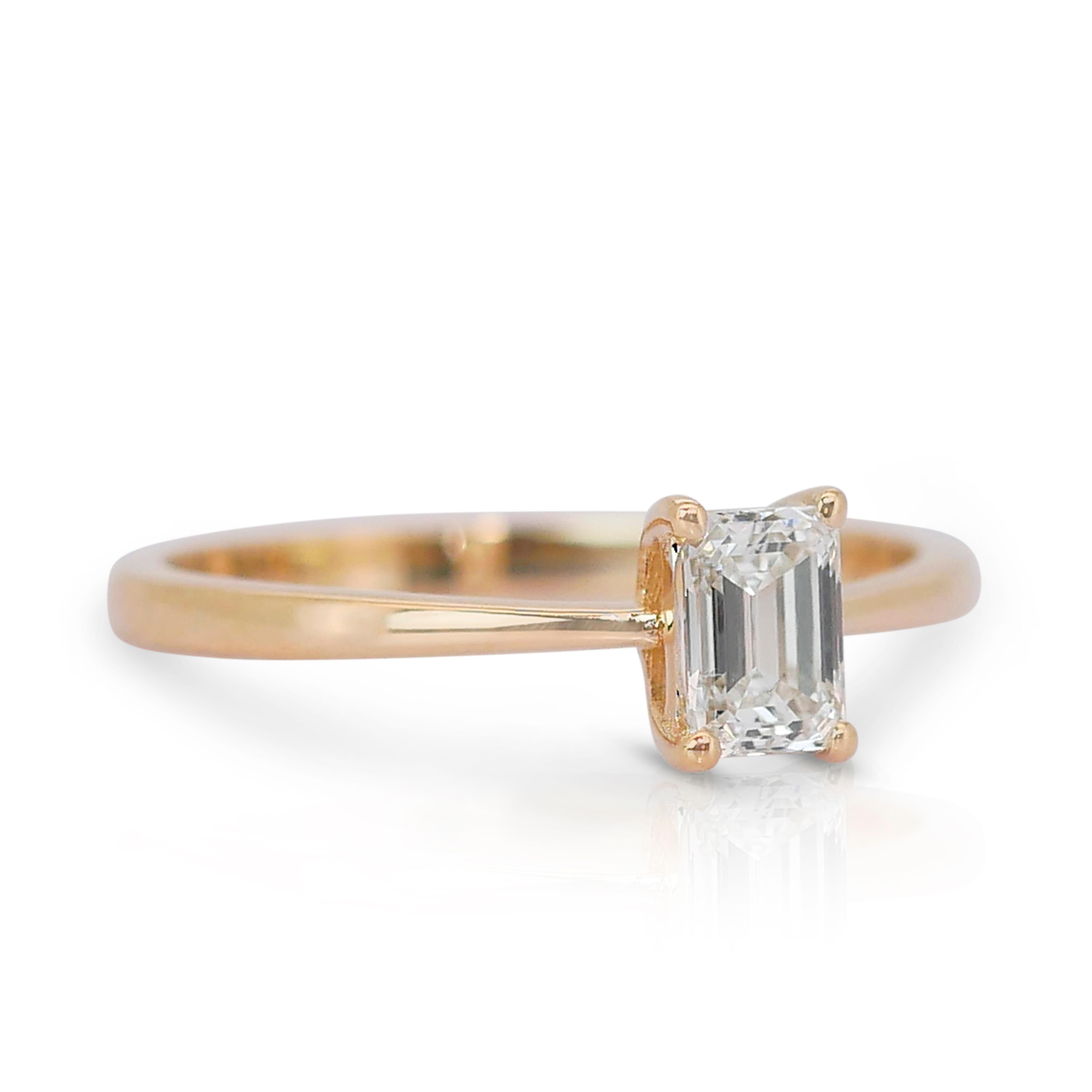 Timeless 0.90ct Diamond Solitaire Ring in 18k Yellow Gold - GIA Certified

Discover the epitome of sophistication with this exquisite diamond solitaire ring, featuring a stunning 0.90-carat emerald-cut diamond at its centerpiece. The classic emerald