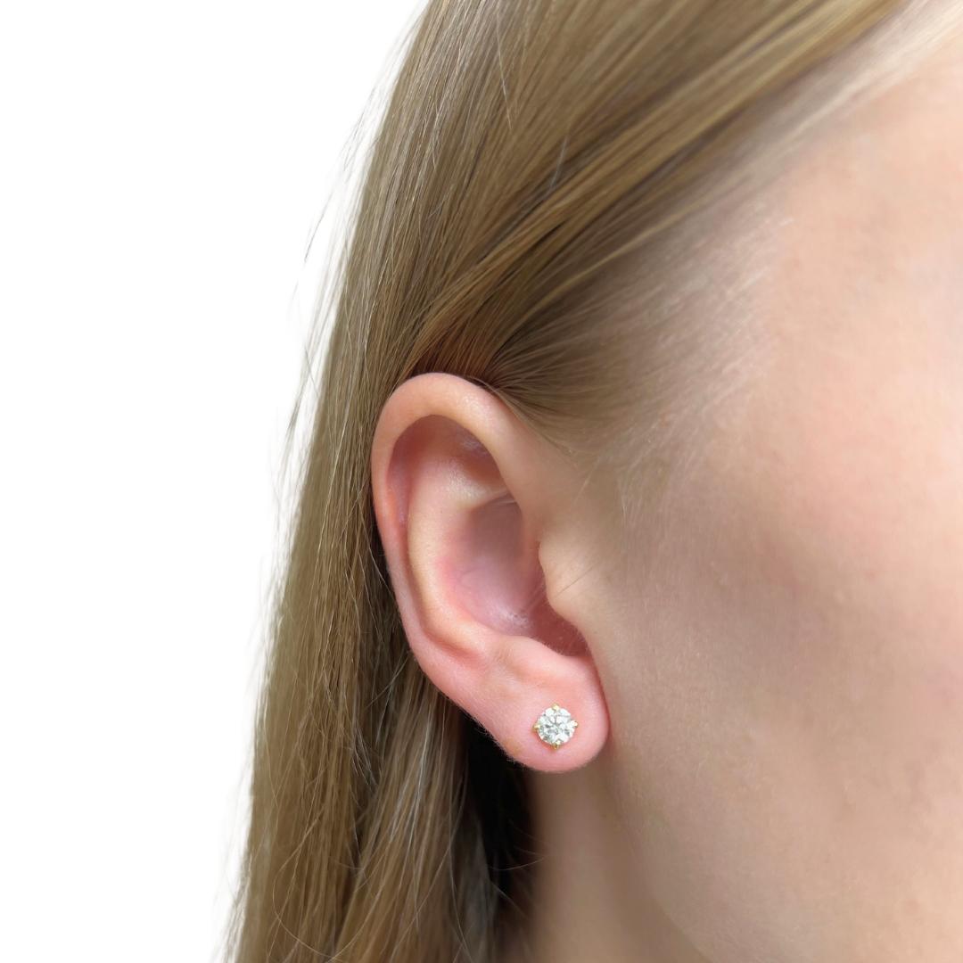 Add a touch of timeless elegance with these 18K yellow gold diamond stud earrings. Featuring two brilliant round diamonds totaling 1.02-carat, with exceptional color and clarity, these earrings deliver remarkable sparkle and radiance. IGI-certified