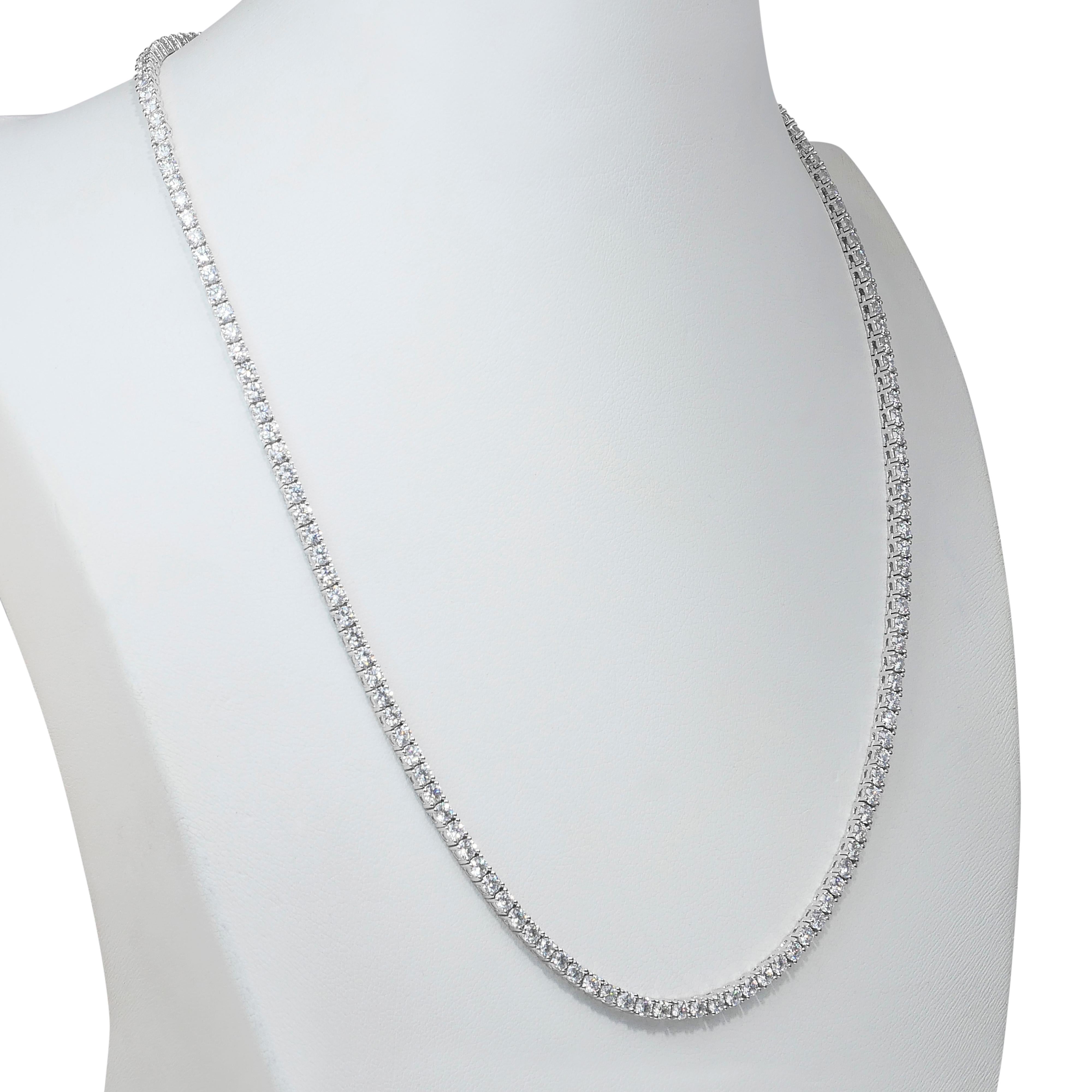 Timeless 10.88ct Diamonds Necklace in 18k White Gold - IGI Certified

A true masterpiece of luxury, this radiant necklace showcases 154 round-cut diamonds totaling an impressive 10.88ct. With a very good cut grade, these diamonds emit captivating