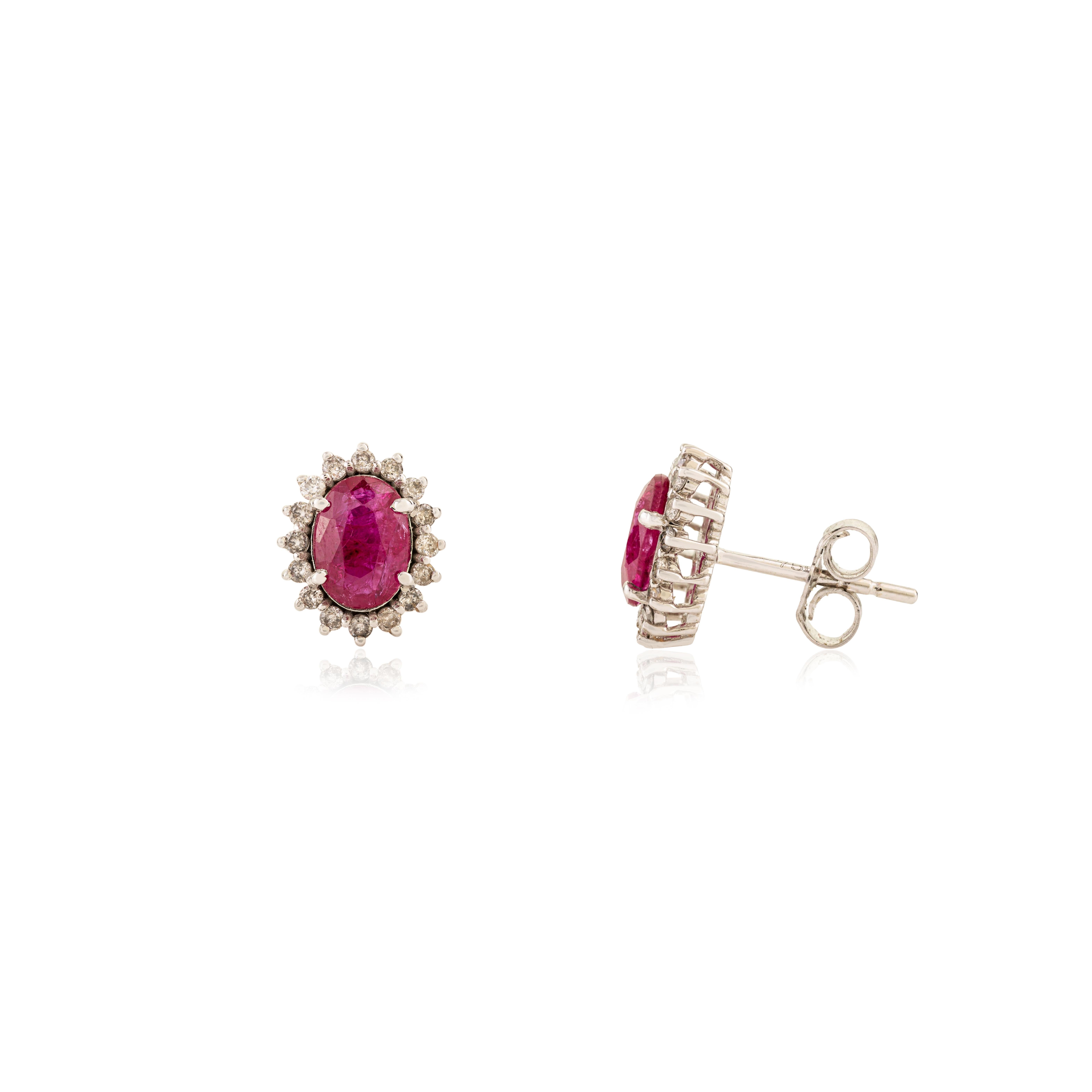 Timeless 1.45 Carat Oval Cut Ruby & Diamond Halo Stud Earrings in 18K White Gold For Sale 2