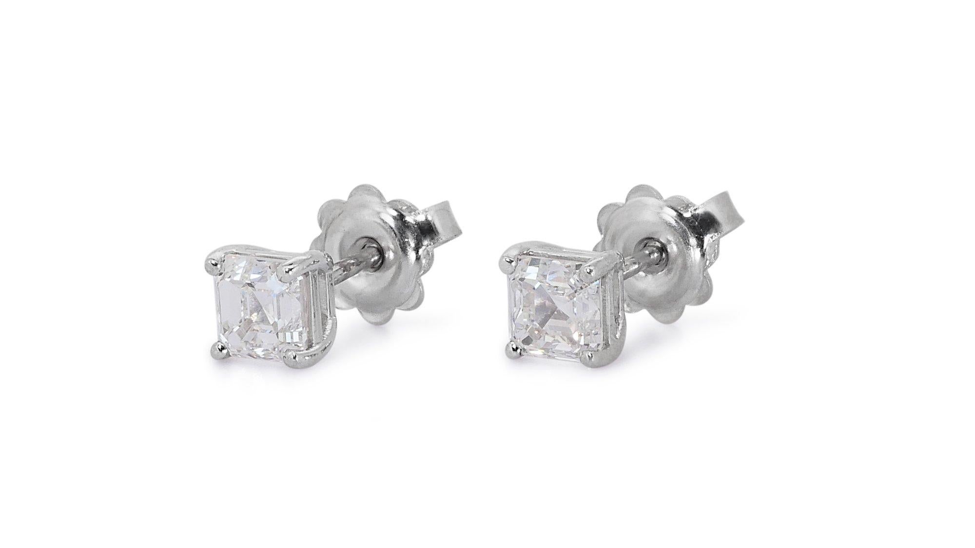 Timeless 2.05ct Diamond Stud Earrings in 18k White Gold - GIA Certified

Unveil the pure radiance of these sleek diamond stud earrings, exquisitely set in 18k white gold. Each earring features a square-cut diamond, together weighing 2.05-carat.