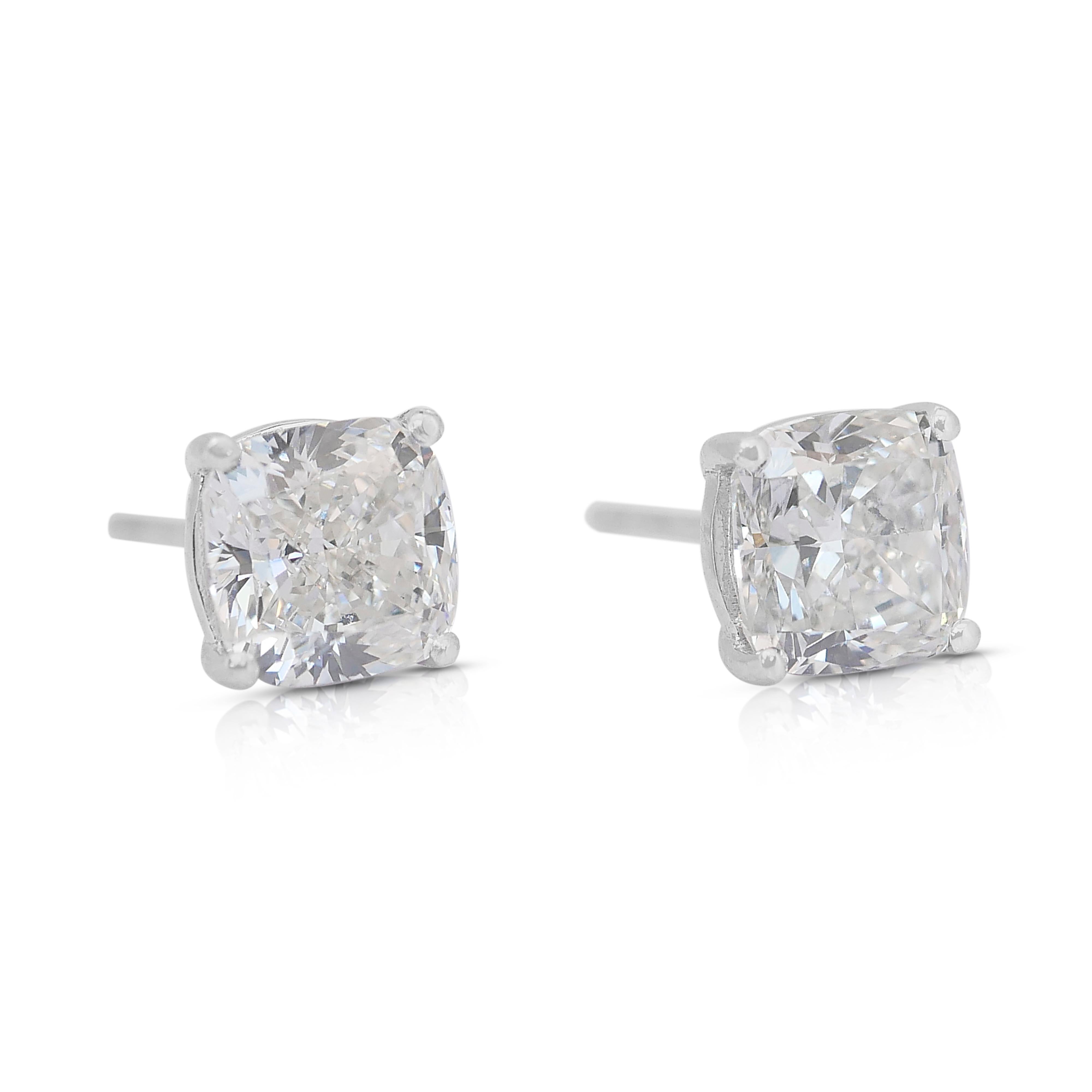 Timeless 3.07ct Diamonds Stud Earrings in 18k White Gold - IGI Certified

Indulge in timeless luxury with these 18K white gold diamond stud earrings, featuring two breathtaking square cushion-cut diamonds totaling 3.07ct. Perfectly balanced at a
