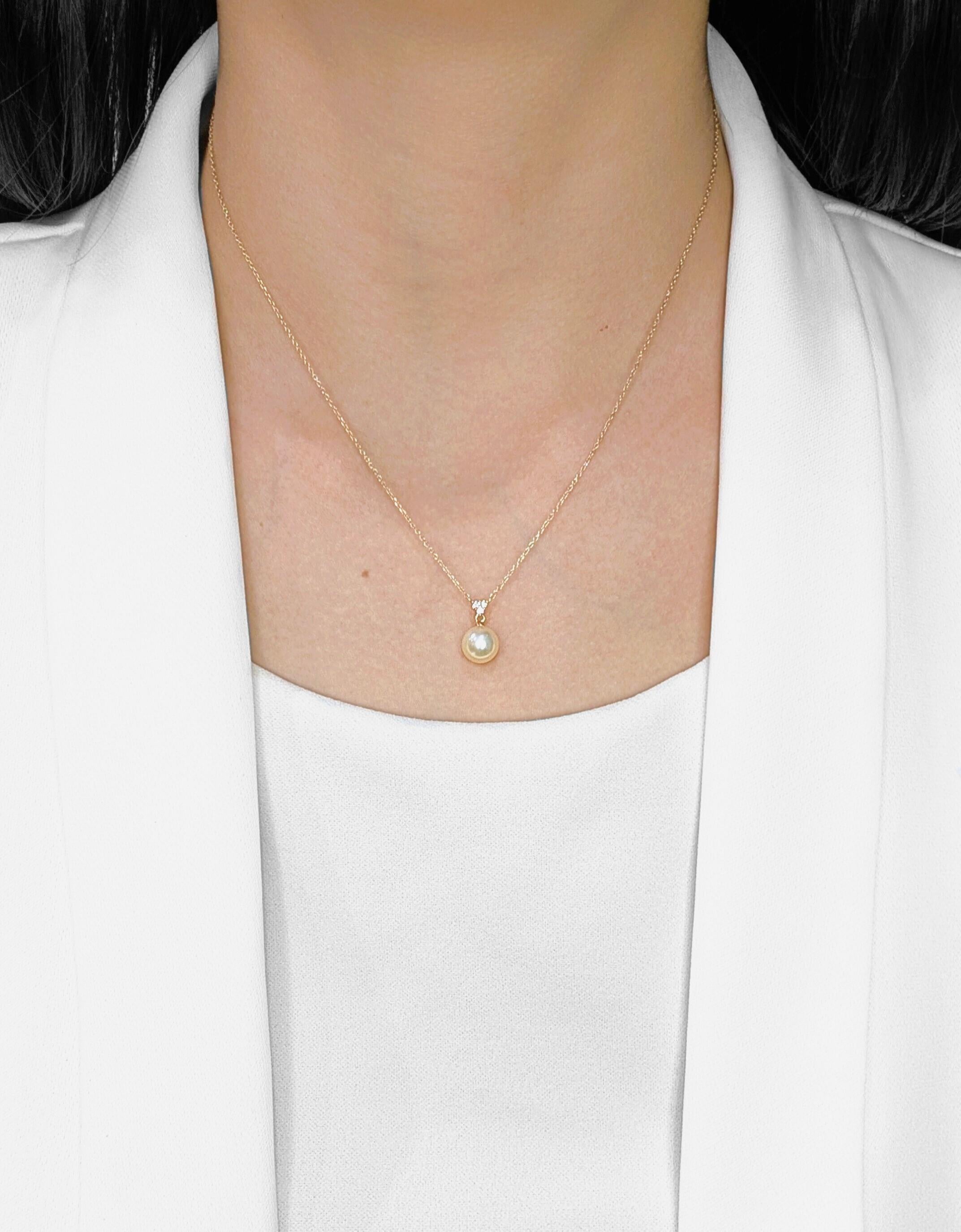 A timeless treasure of sophistication, this necklace features a radiant 7.9MM champagne-toned pearl, perfectly complemented by three natural round brilliant diamonds totaling 0.03ct. The diamonds, graded H-I in color and SI in clarity, add just the