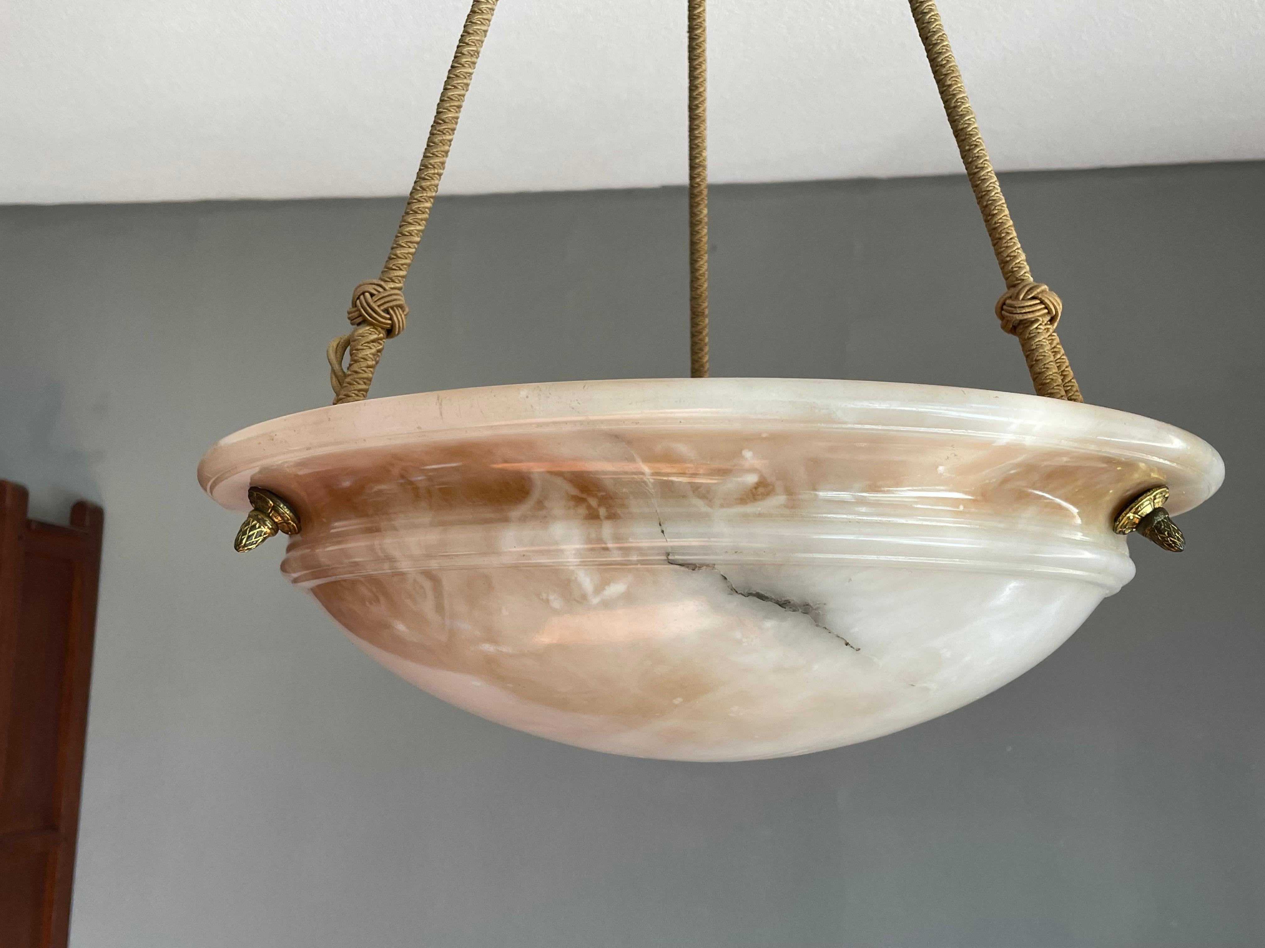 True French Art Deco elegance for the collectors and enthousiasts.

If you are looking for a good size, beautiful, timeless and ready to use alabaster chandelier then this striking French specimen from circa 1920 could be gracing your home soon. The