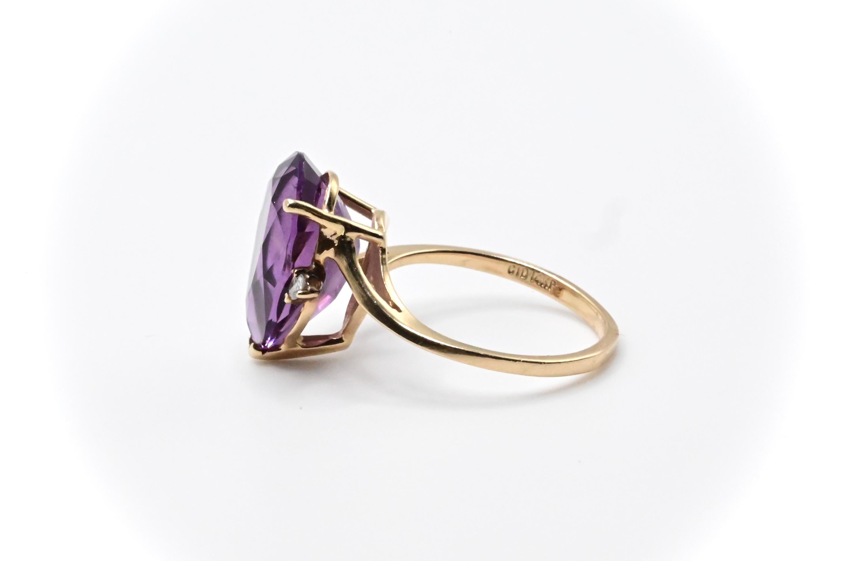 This is a lovely 14k gold ring with a pear cut purple amethyst in the center, and a gorgeous diamond accent on each side. The ring is a size 6 1/4, and weighs about 3 grams. It’s in great condition, and if you have any questions or concerns about