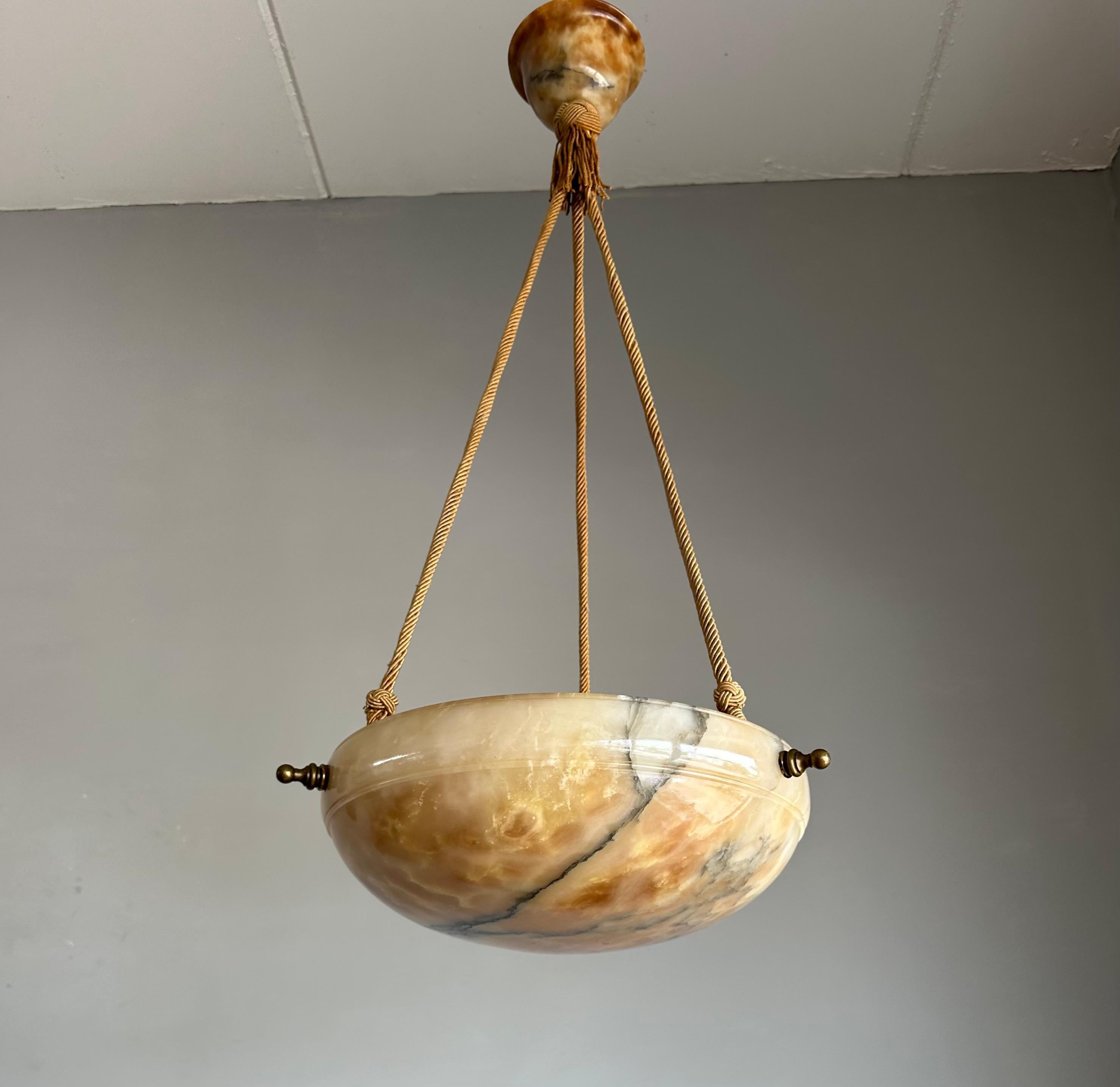 One of a kind light fixture with a stunning “ flameboyant “ alabaster shade disc.

Thanks to its timeless design, its good size and its mint condition this alabaster chandelier will light up both your days and evenings, both in summer and winter